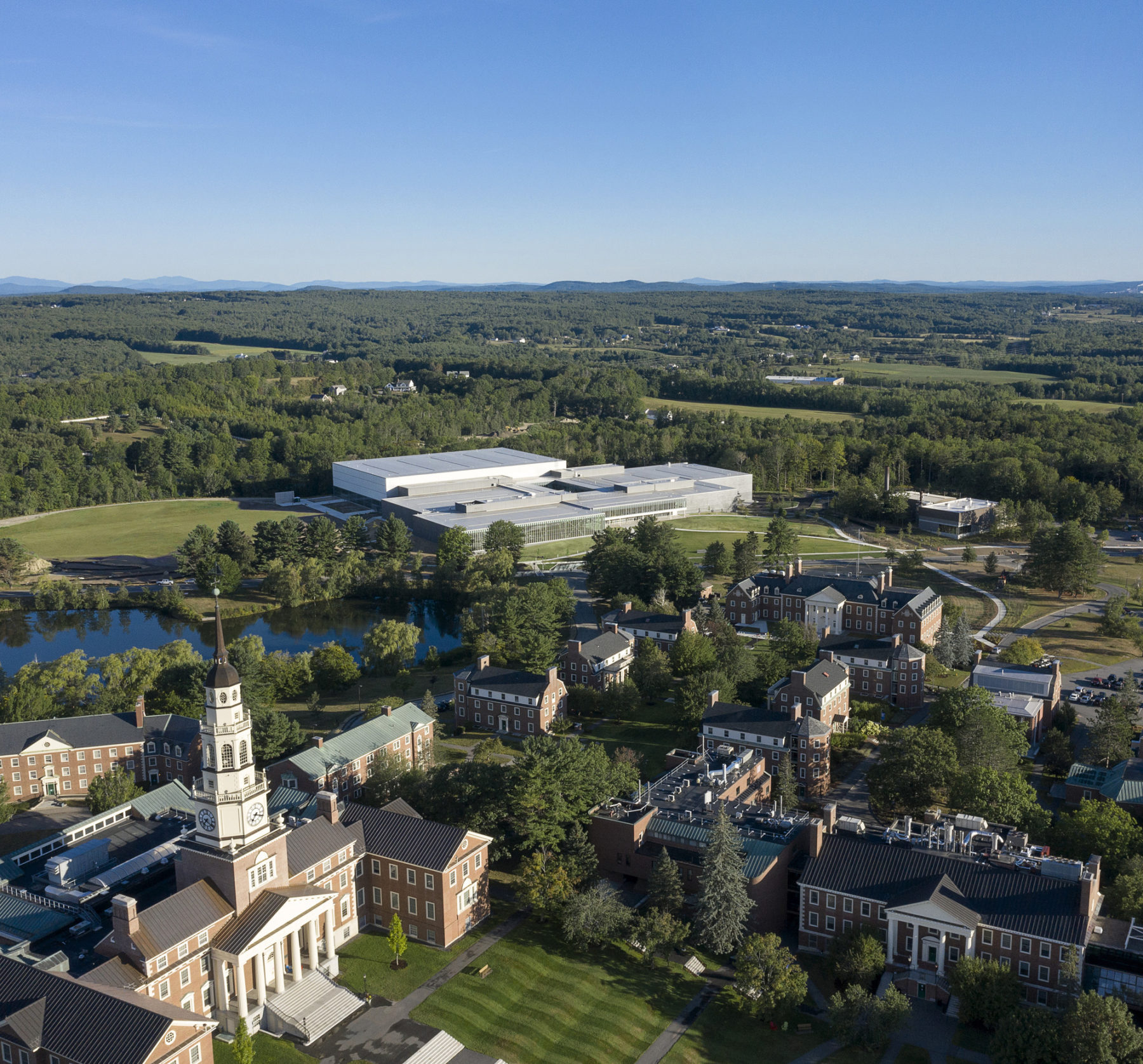 exterior aerial photo of building from lower part of campus