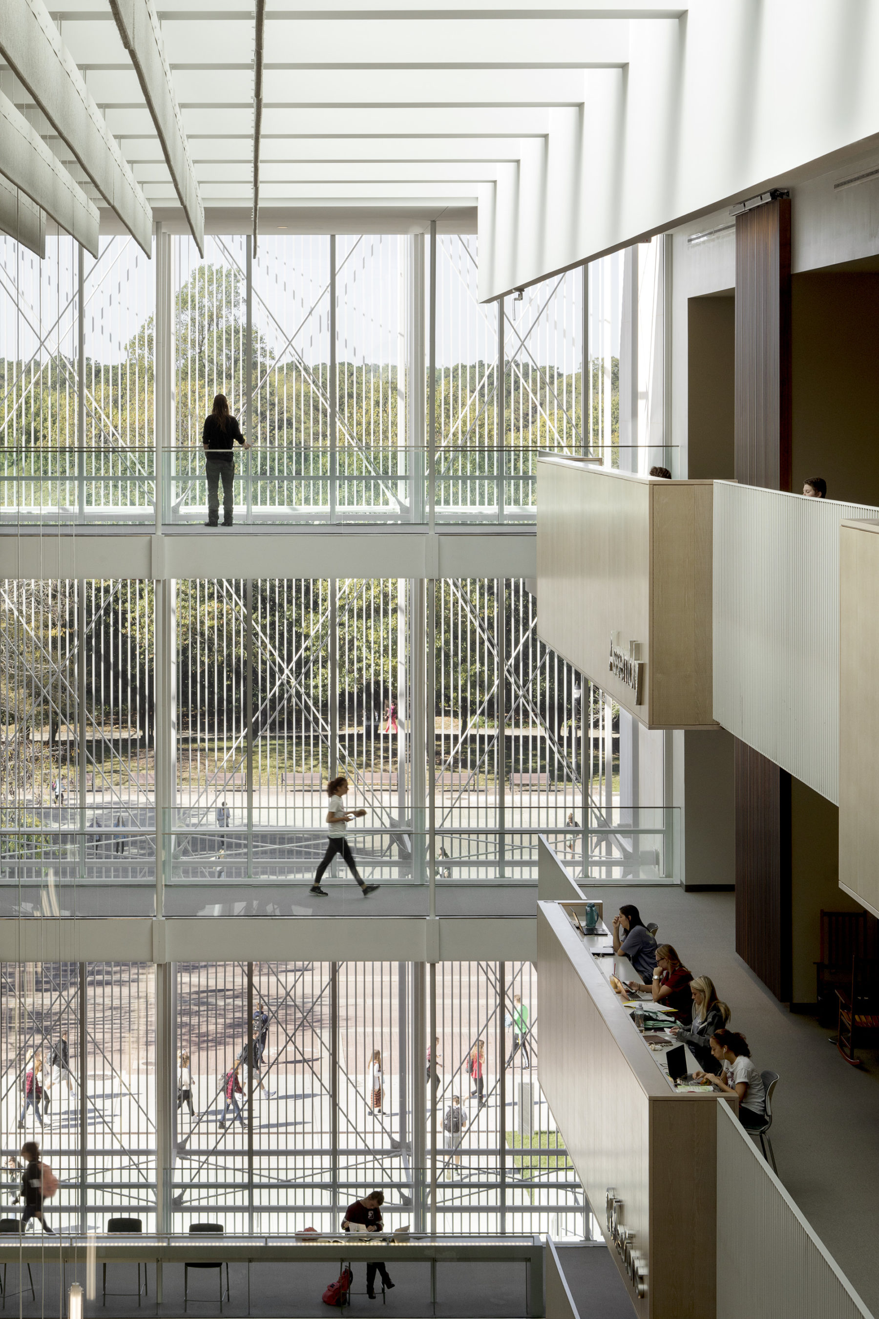 people walking at different levels in building interior