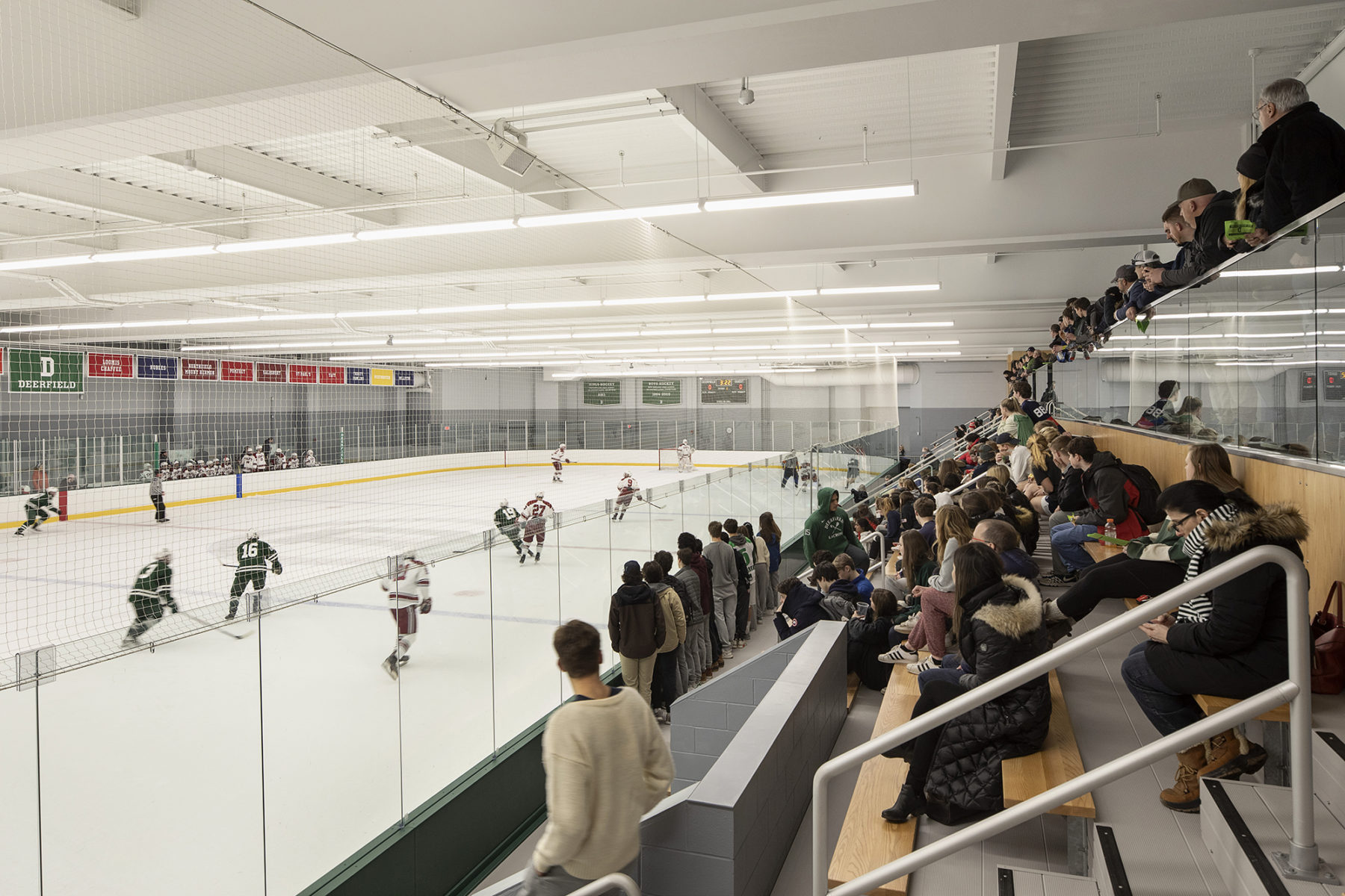 ice rink with people watching from the stands