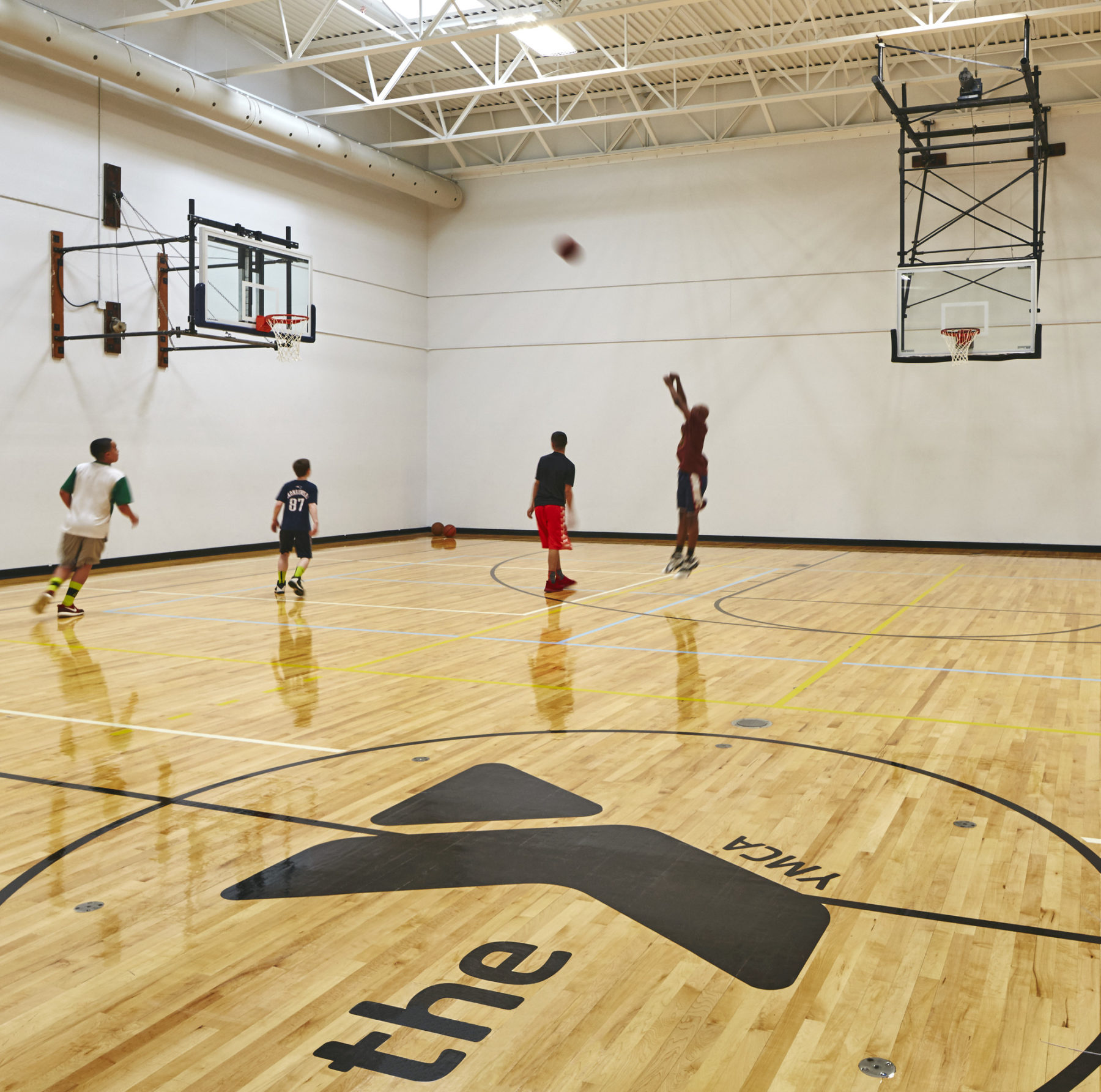 people playing on a basketball court