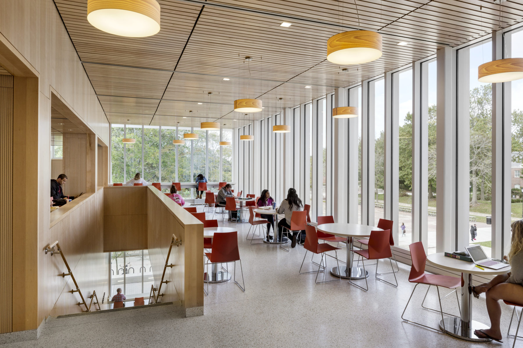 students at tables near windows