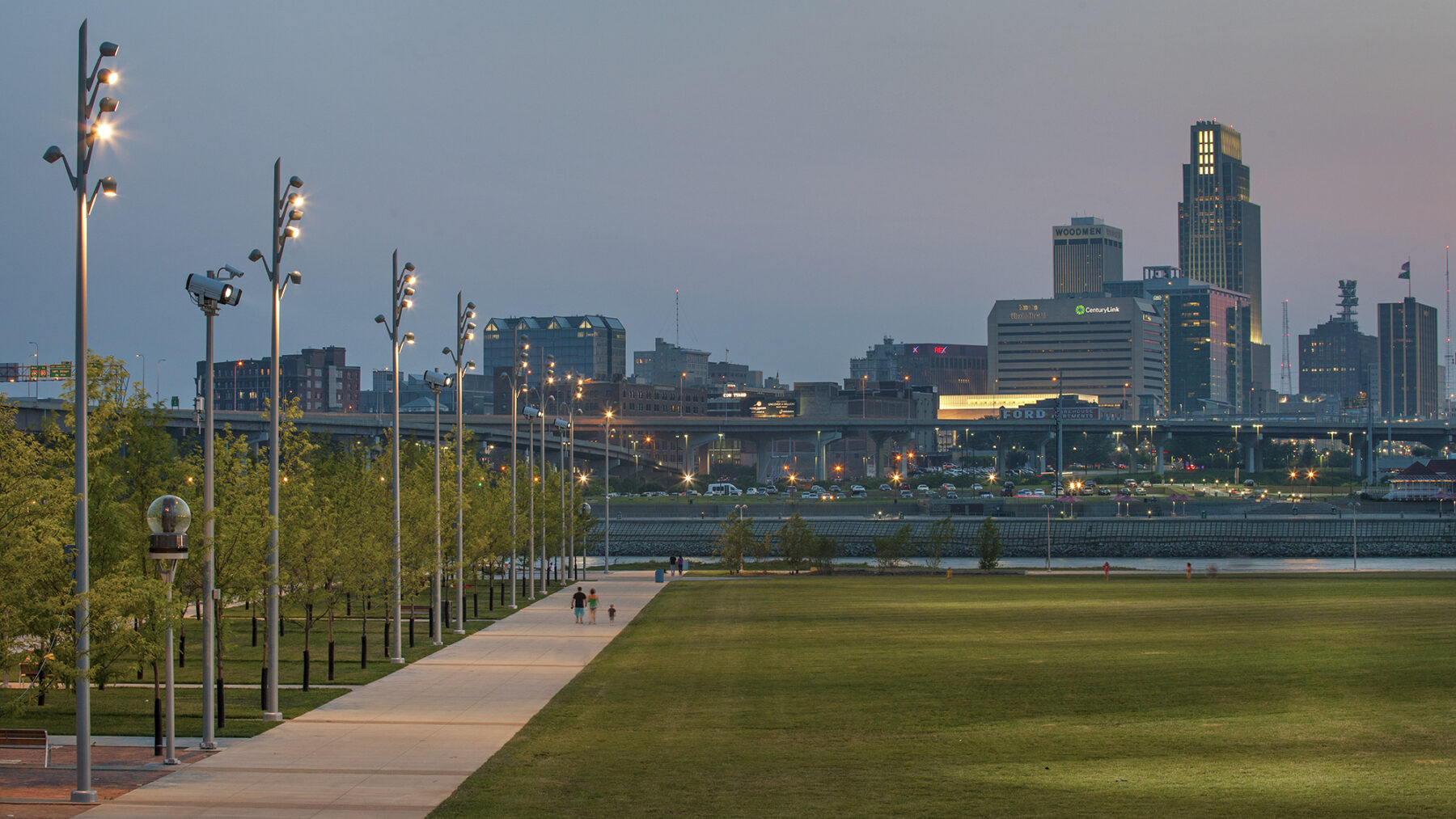 Vast landscape with walkway and cityscape in the background