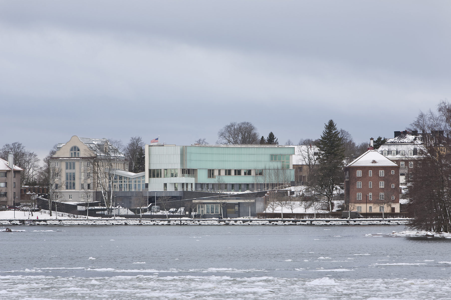 winter photo of embassy from across the water