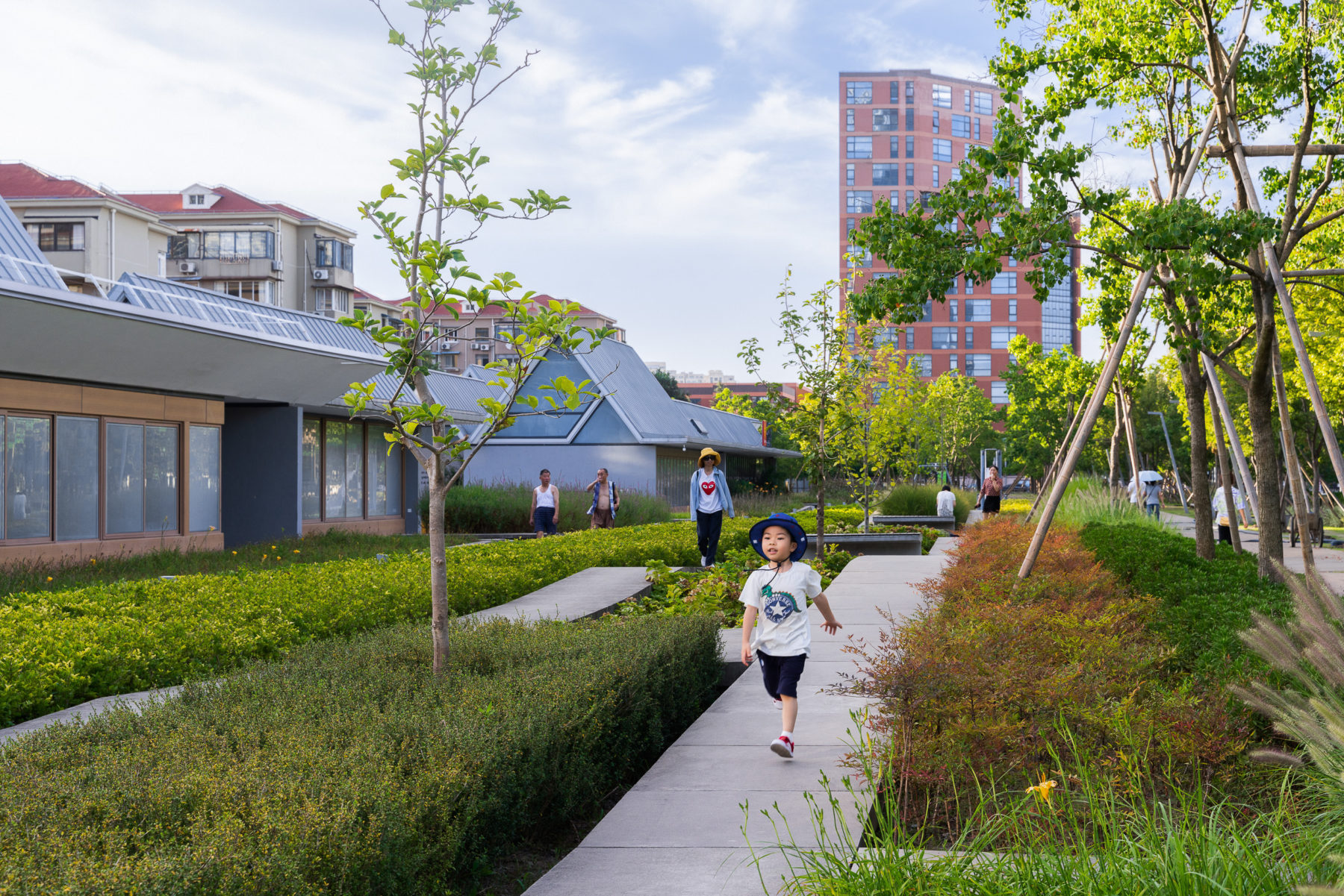 A child walks down a path at Xuhui Runway Park