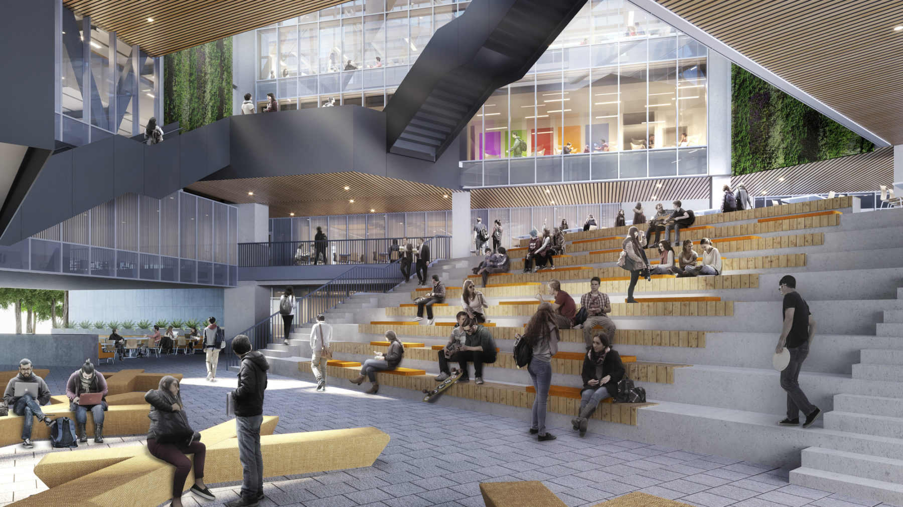 Students seated on stairs within open atrium