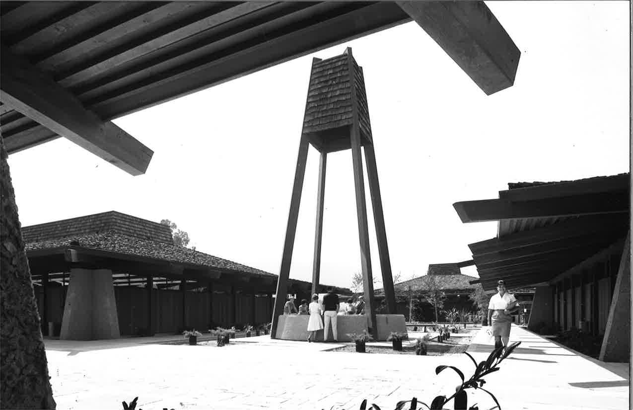 black and white photograph of students relaxing in courtyard of Foothill College campus