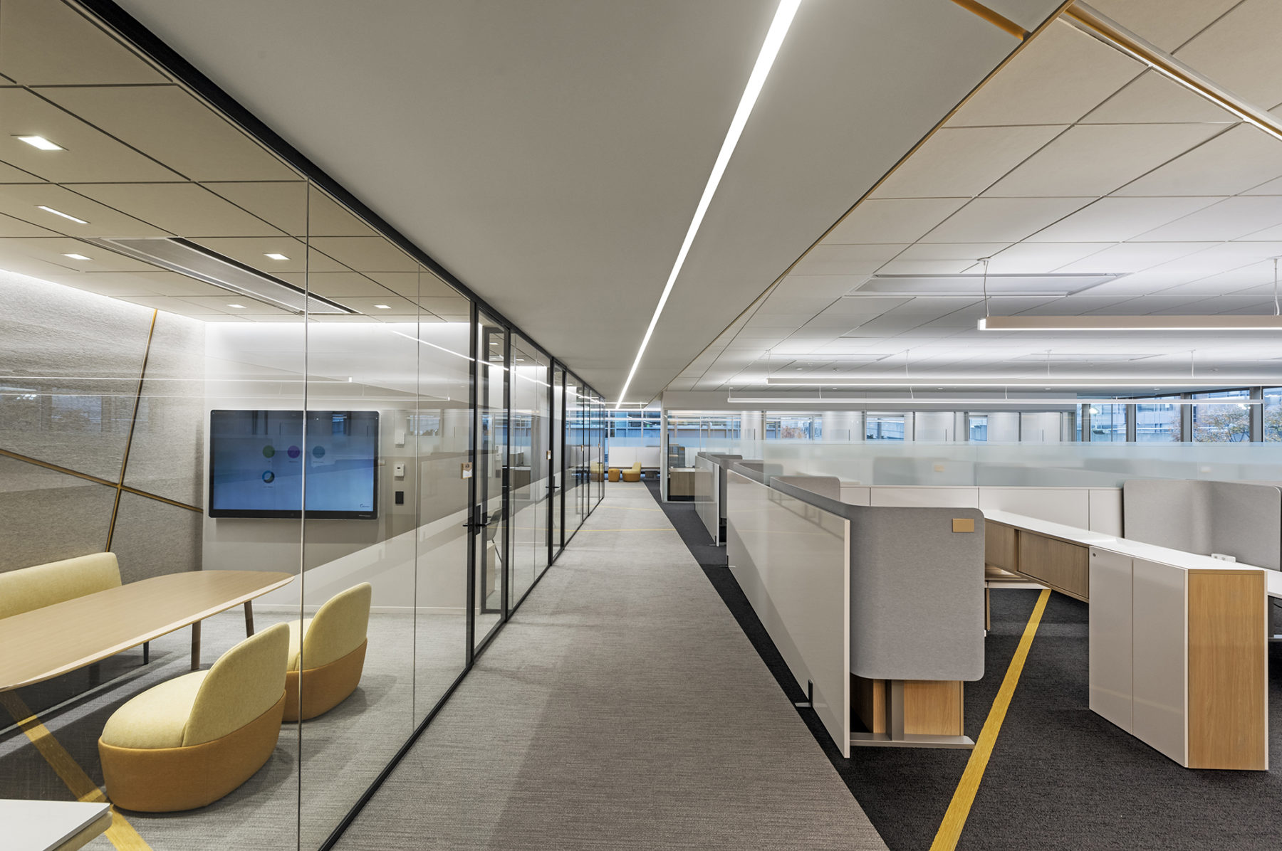 conference rooms line the edge of individual desk areas