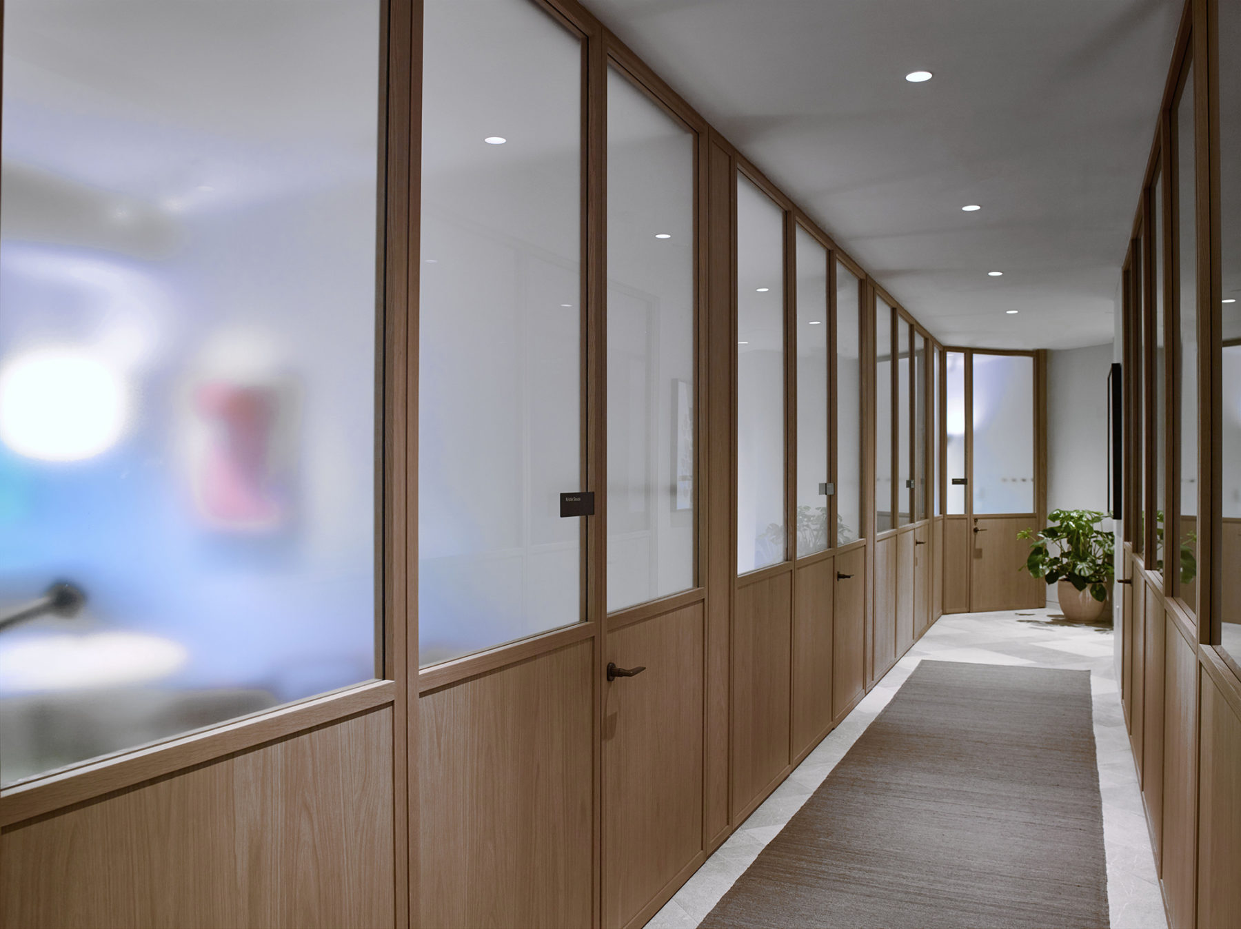 hallway corridor with millwork and frosted glass