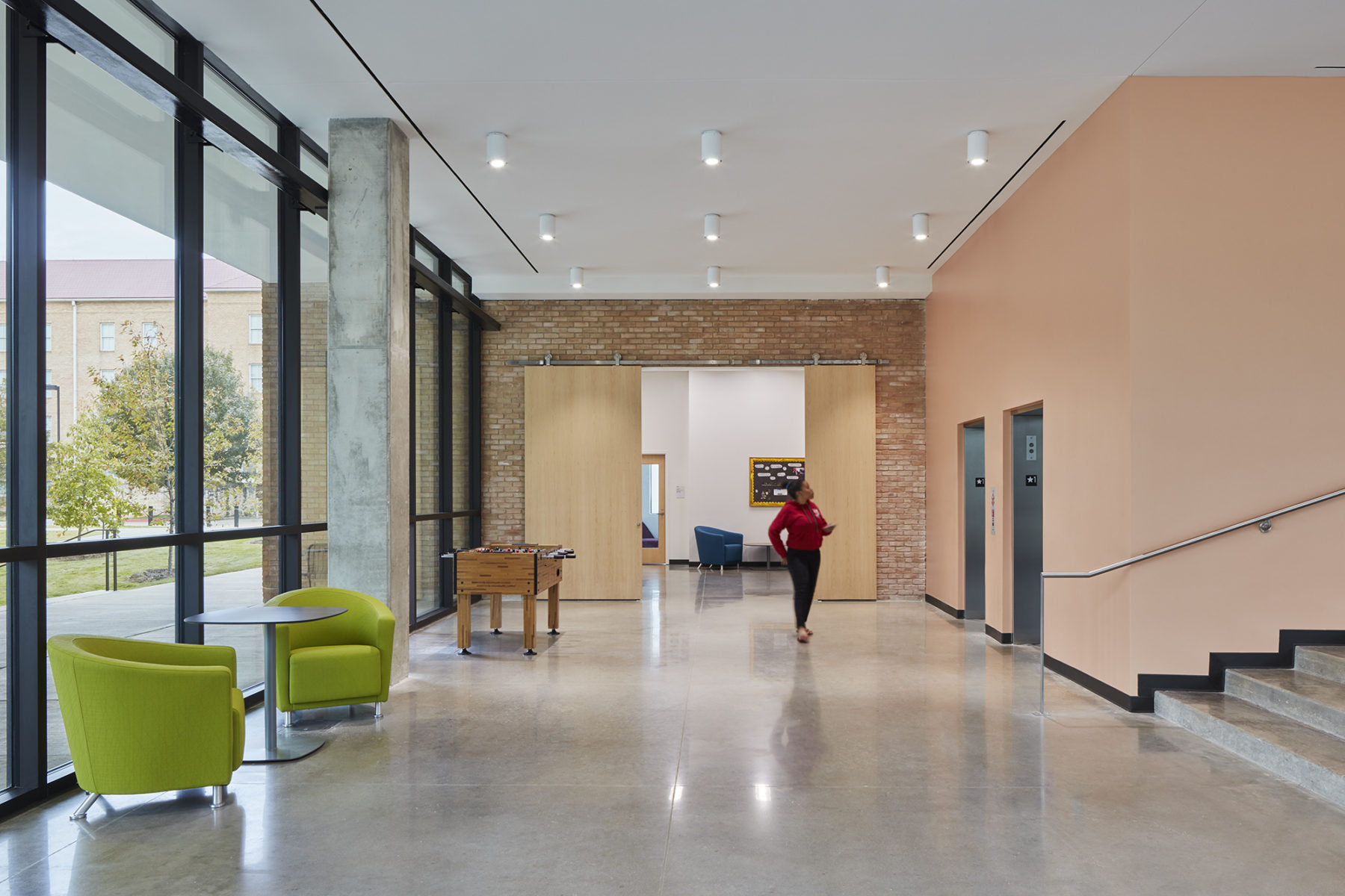 interior lobby space, sliding barn door in front