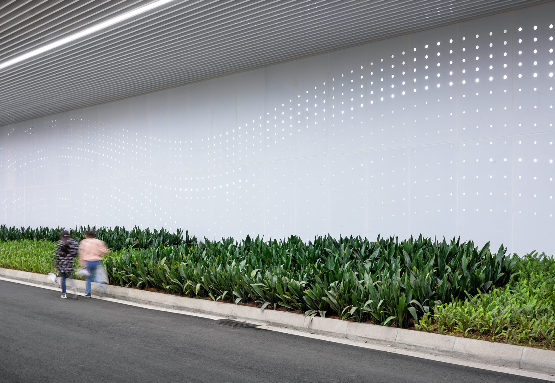 people walking through tunnel