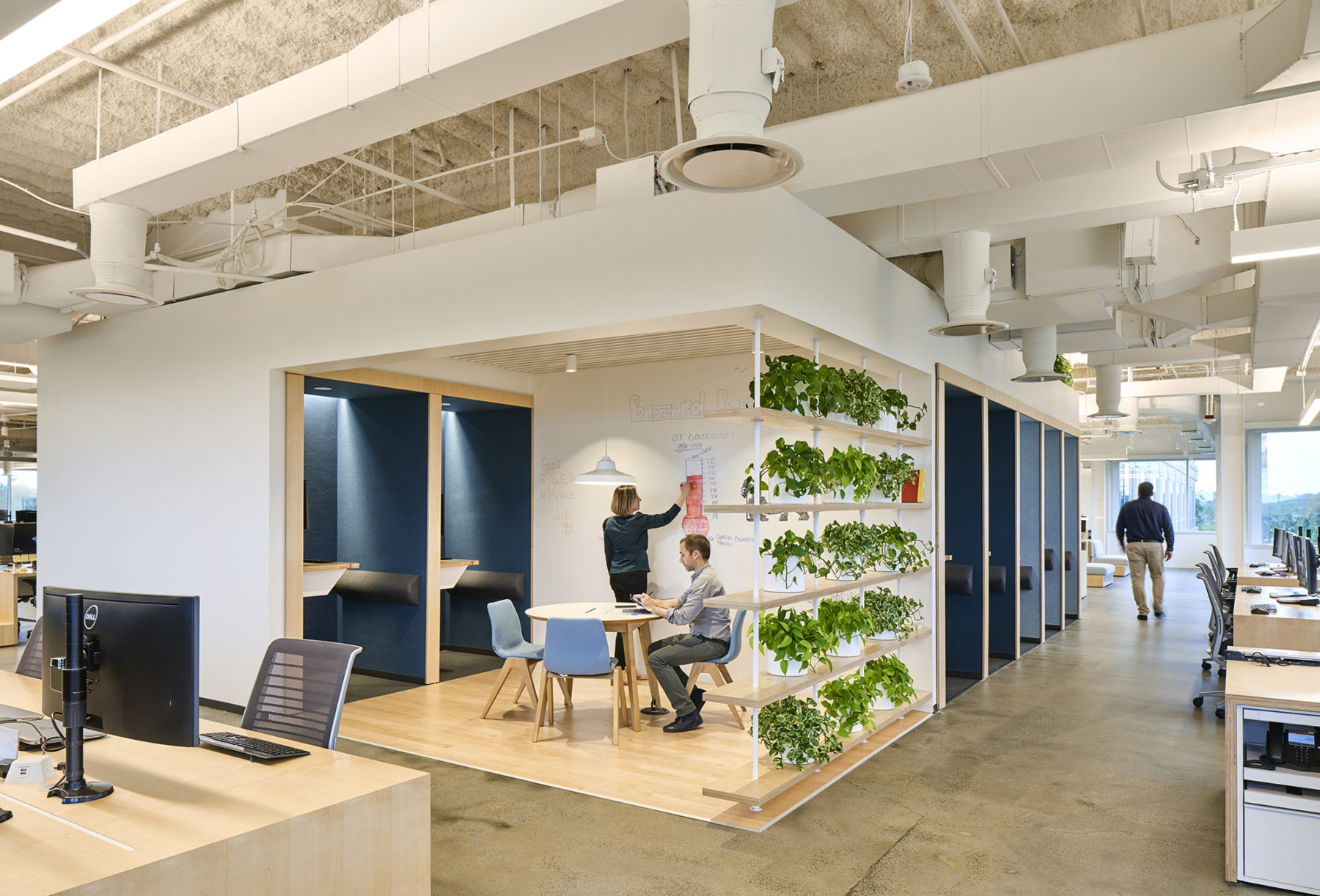 open meeting space and green wall