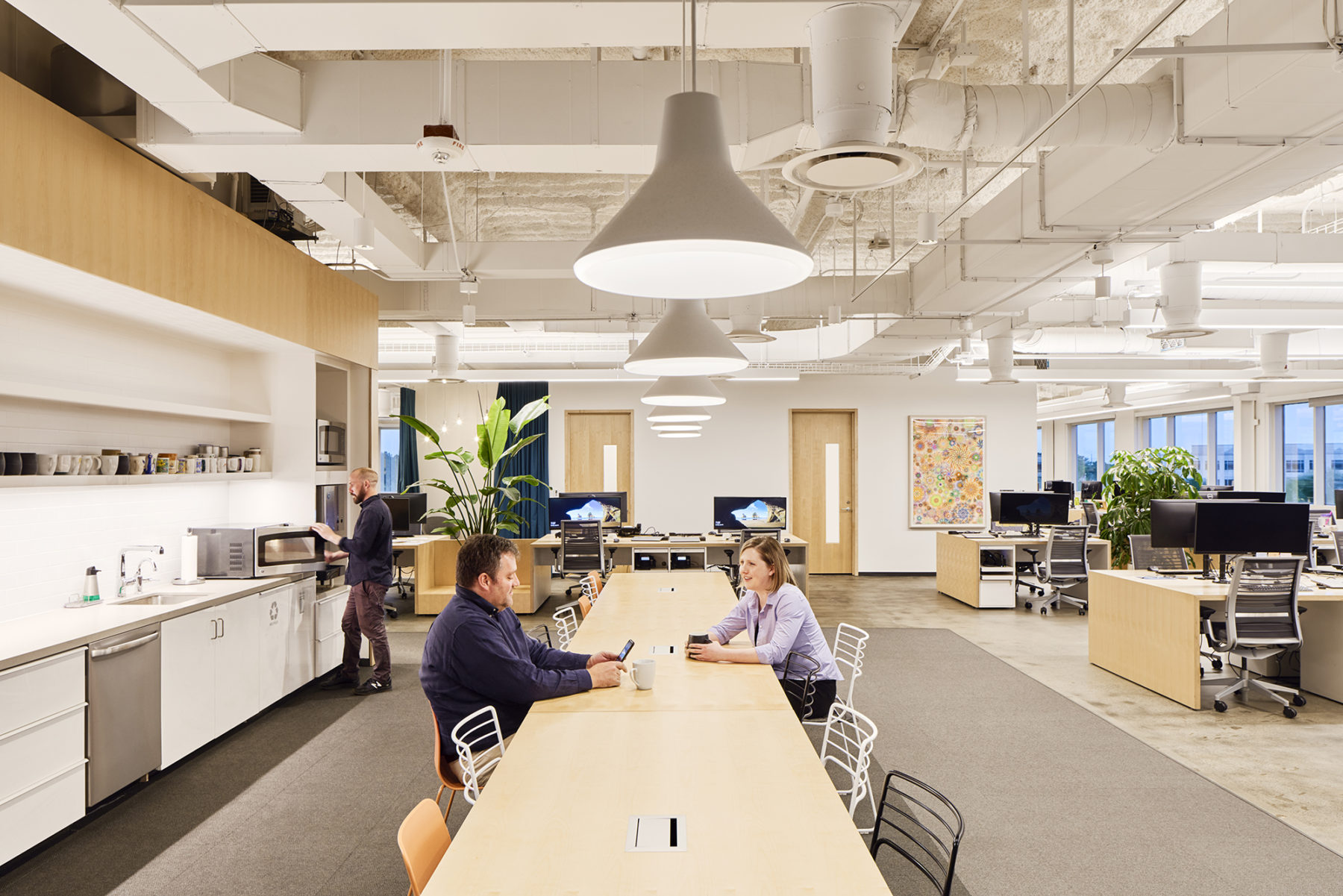 office common kitchen area, workstations to the right