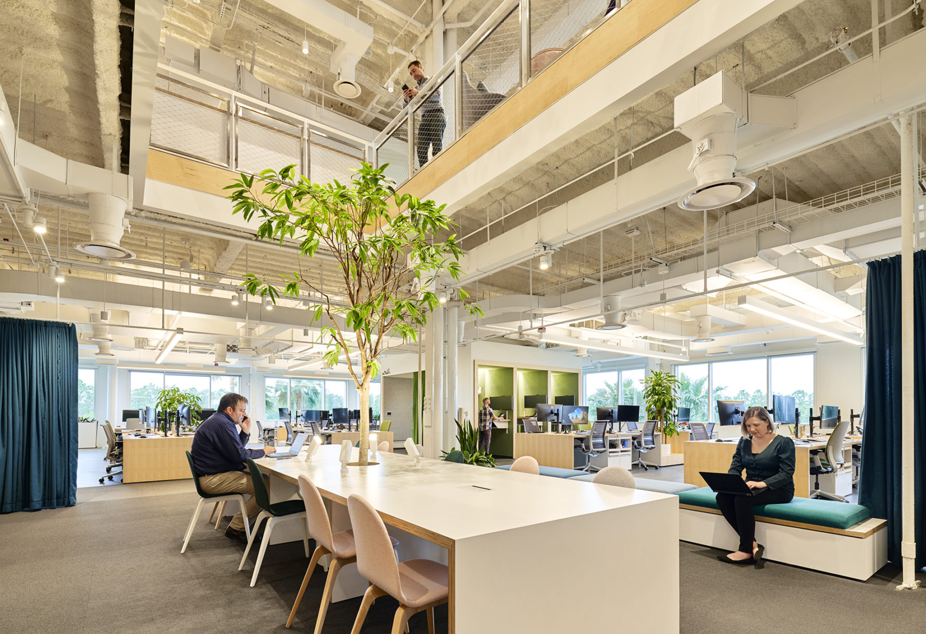 double-height meeting space open to upper floor