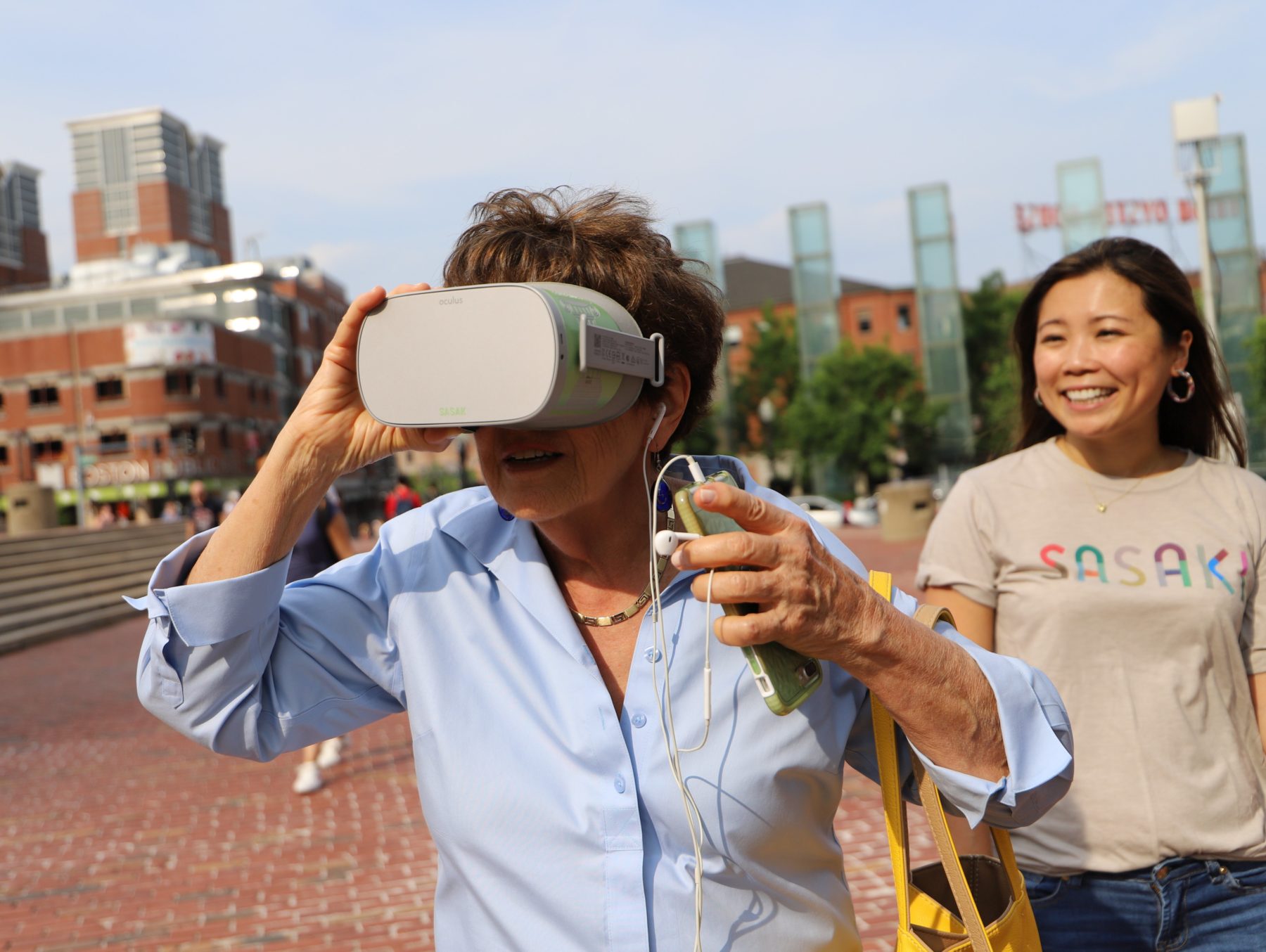 a woman views a 3D panoramic image through a headset