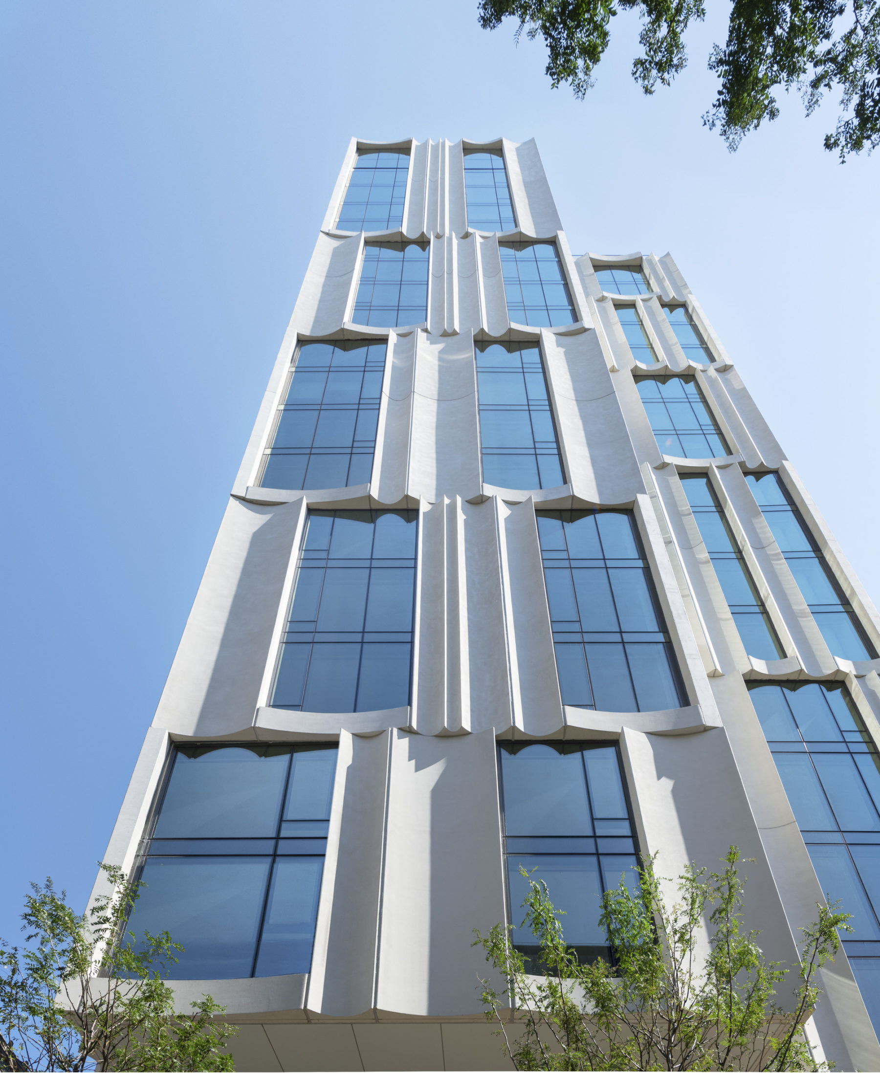 photo of building exterior from ground looking up at the narrow side of the building