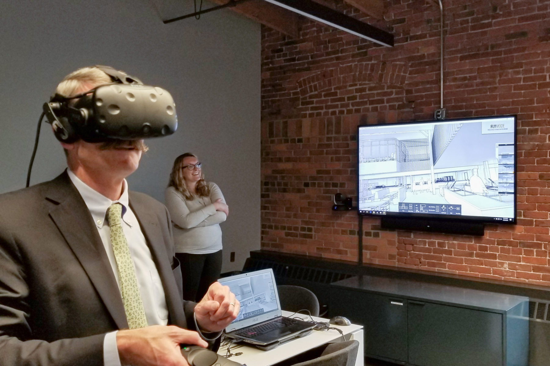 Man using VR headset and pointer