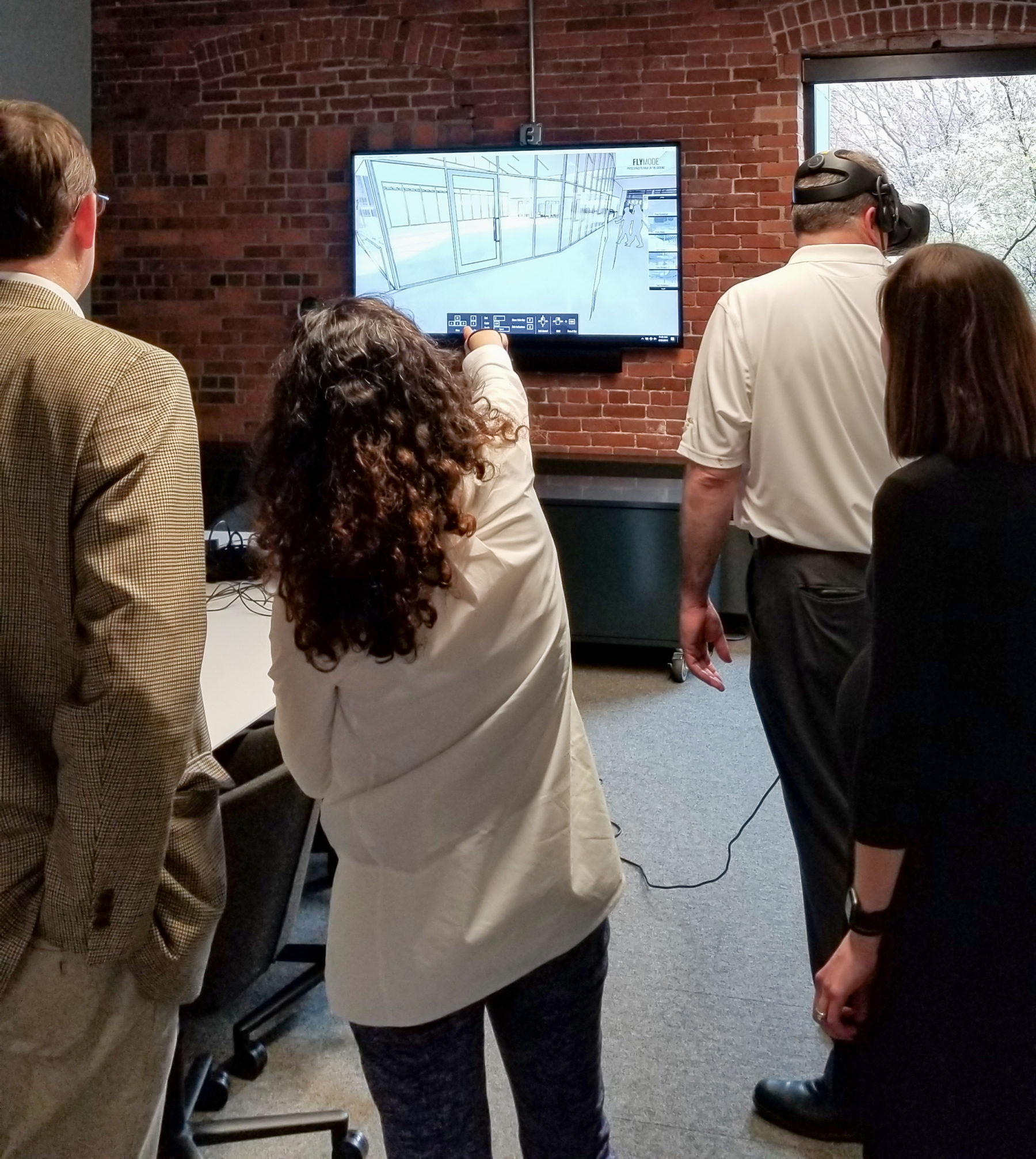 Group of people using pointer to explore VR