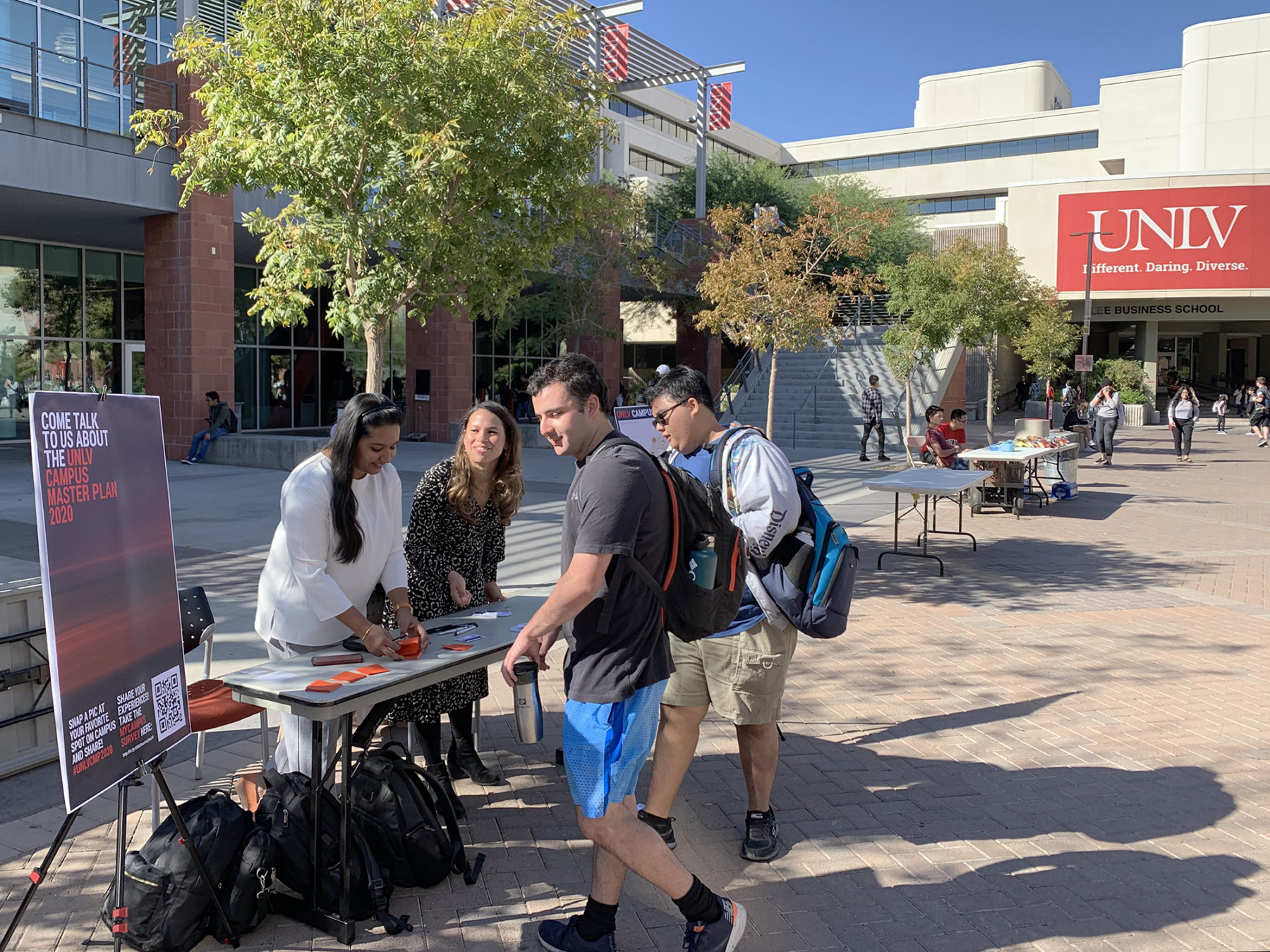 photo of sasaki employees interacting with students on campus