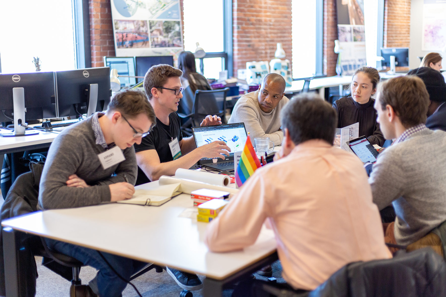 group of people discussing at a table