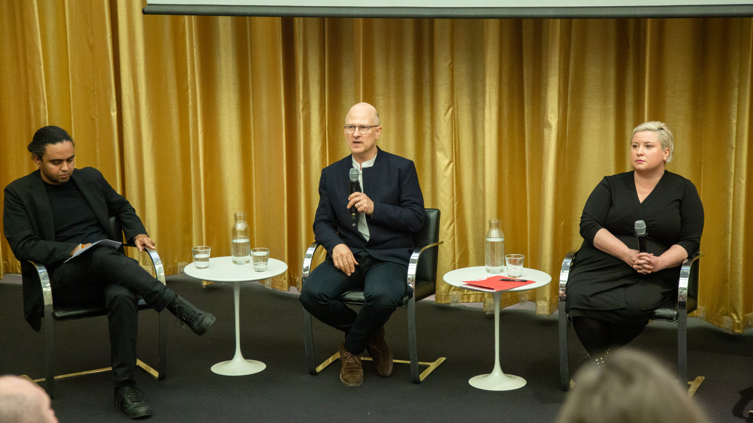 Principal Martin Zogran speaks on a panel to an audience