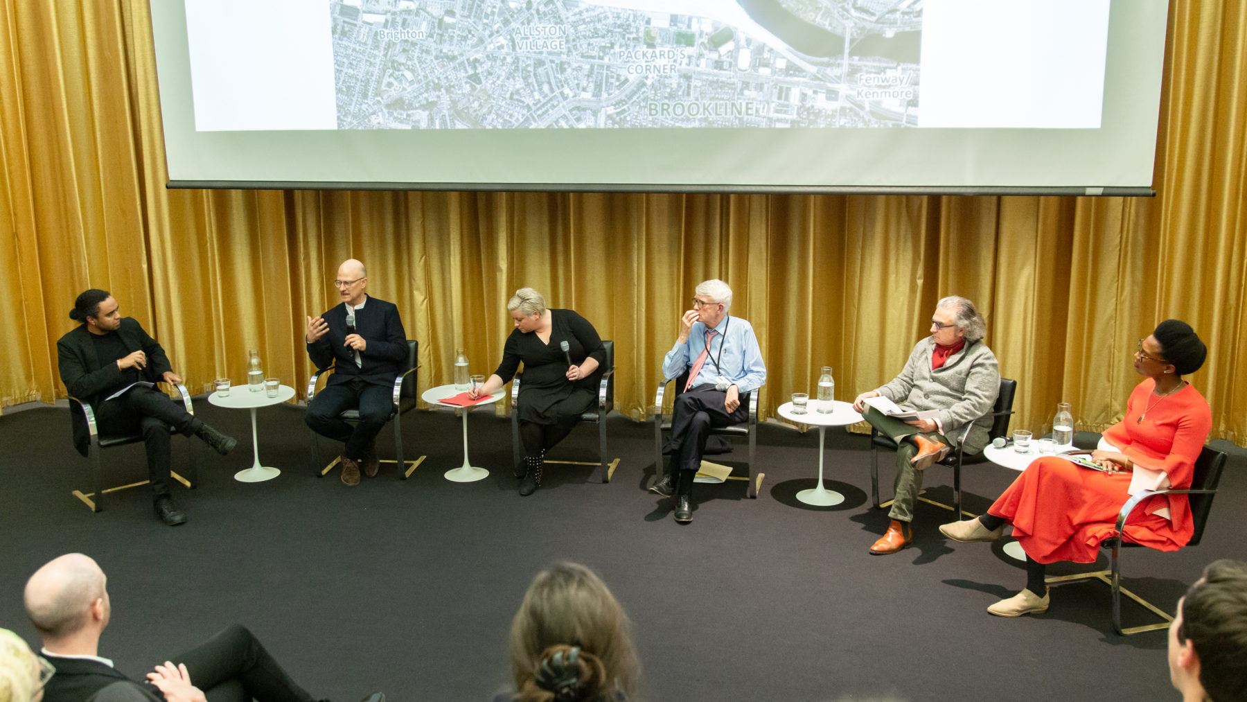 panelists speak to an audience