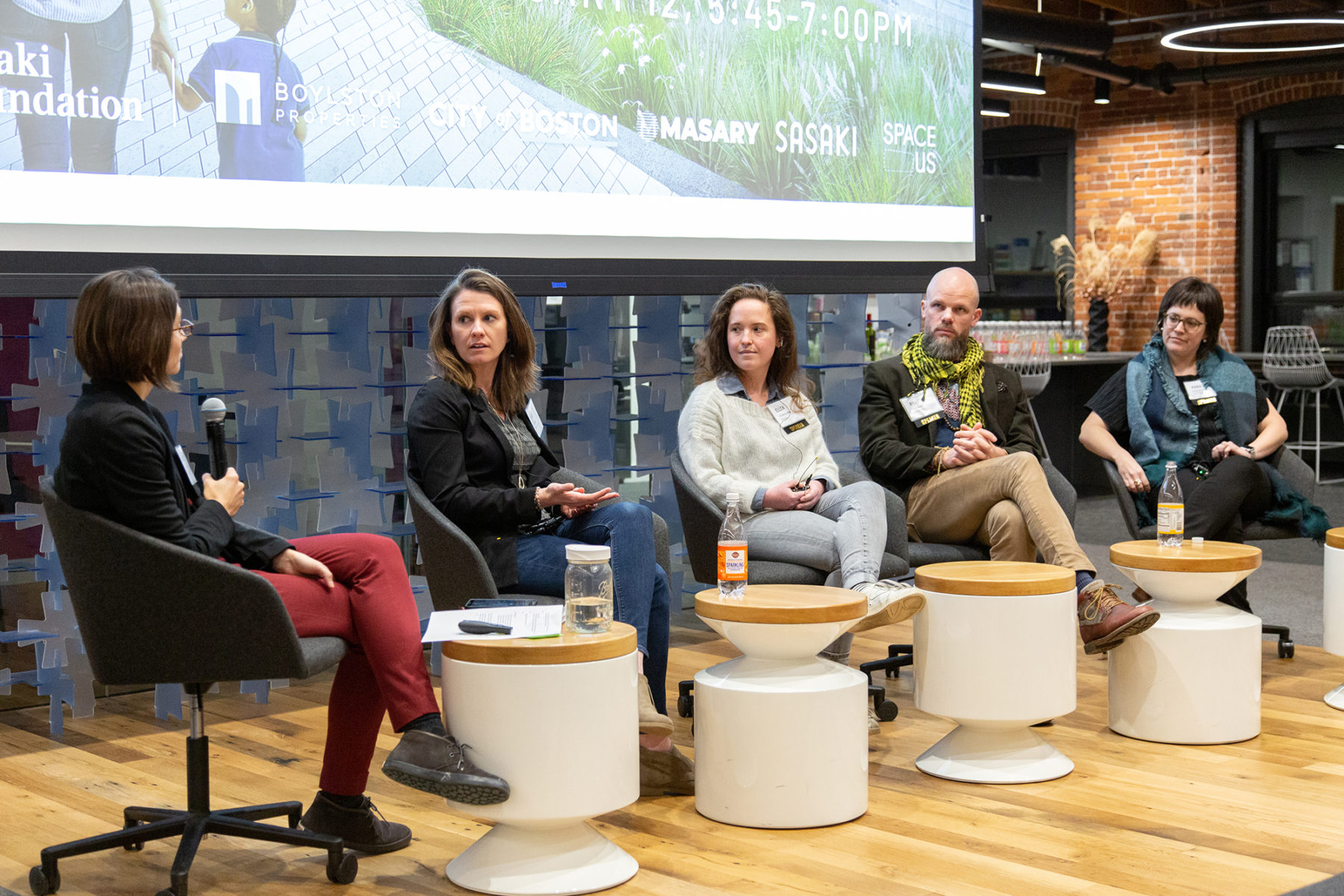 panelists sitting at the front of a room