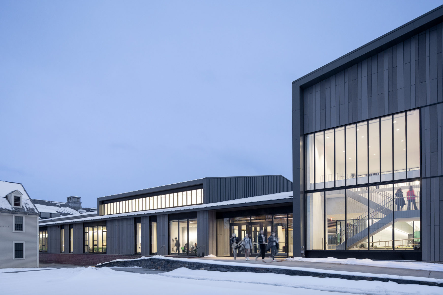 snowy night view of campus athletics center