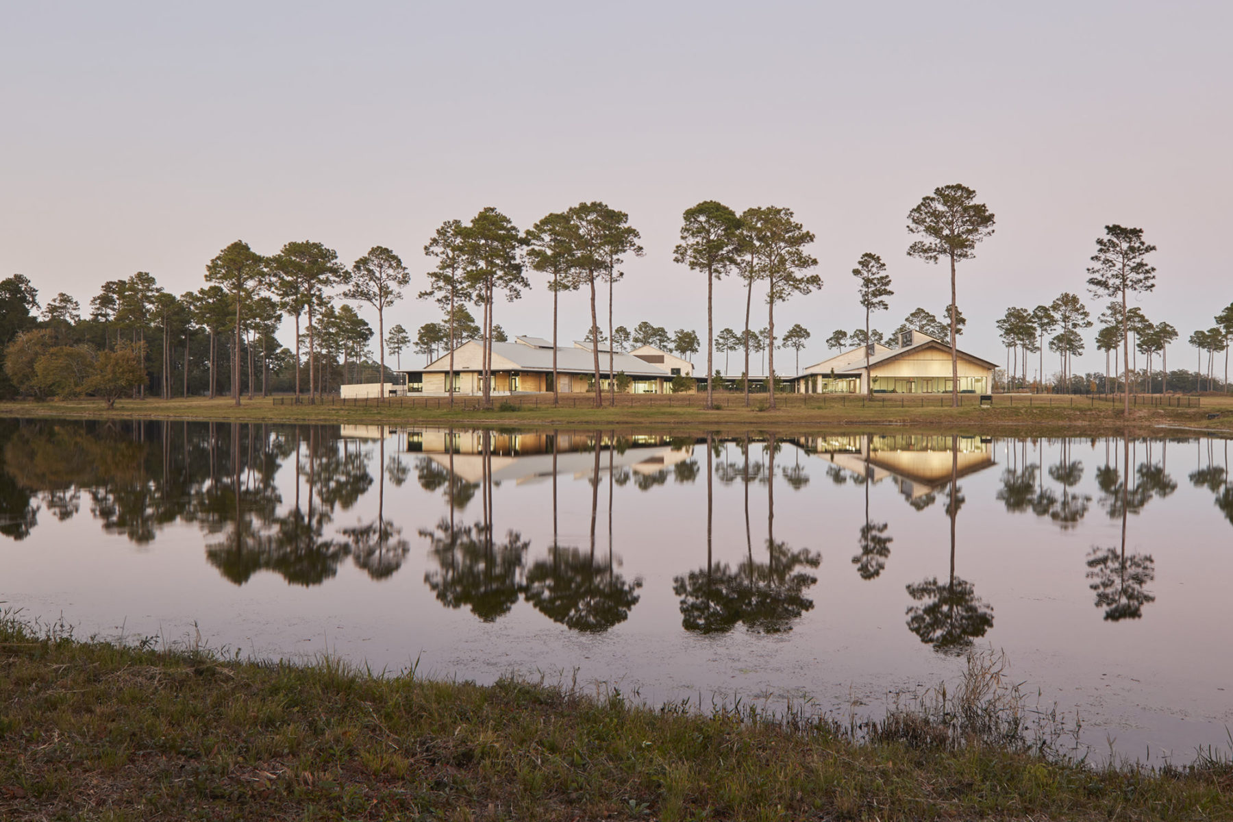 long view of building from across pond