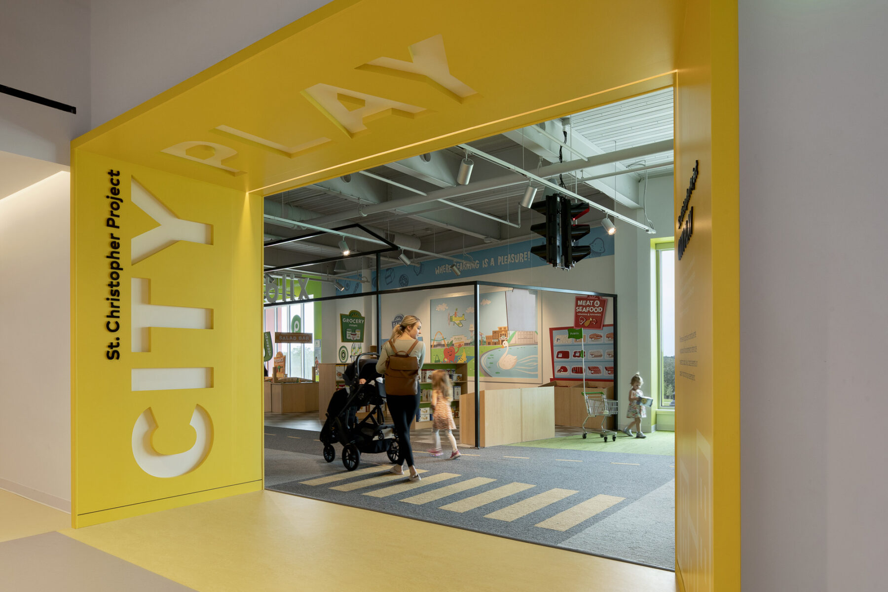 photograph of bright yellow entryway into City Play exhibit at florida childrens museum