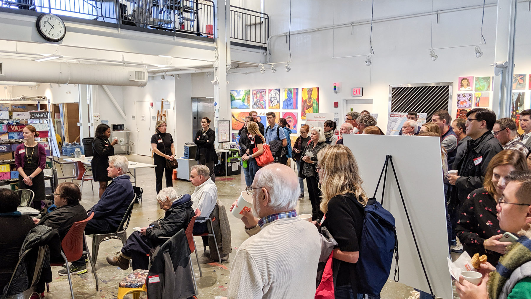 large group gathered in arts space