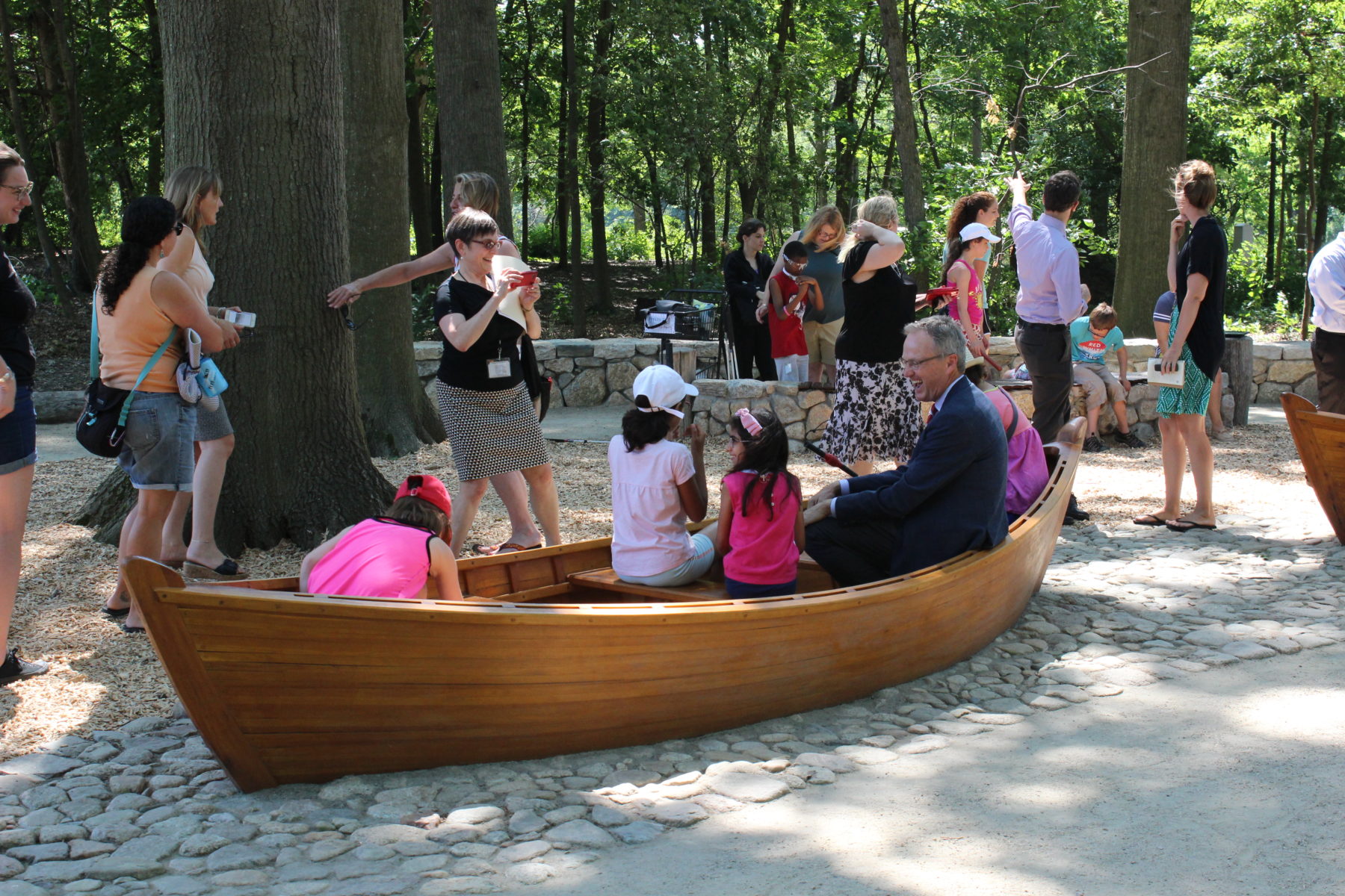 People playing in wooden boat