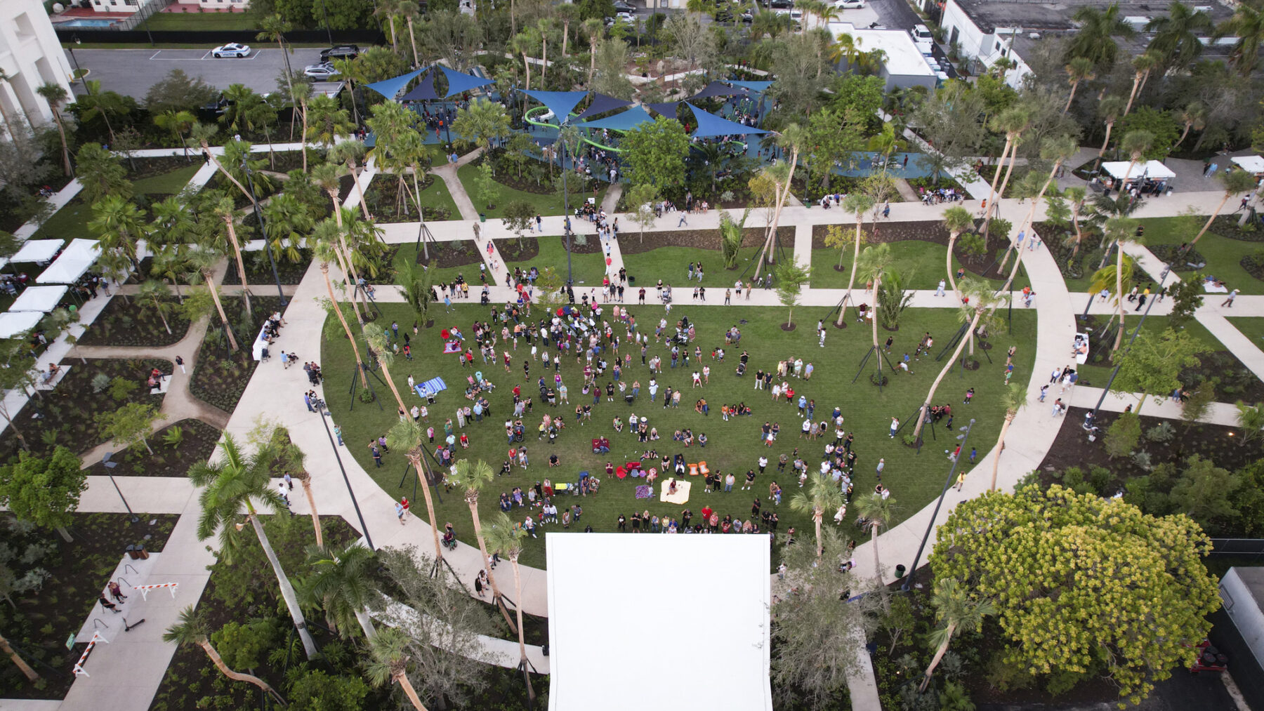 aerial photograph of visitors at losner park gathering in front of event stage