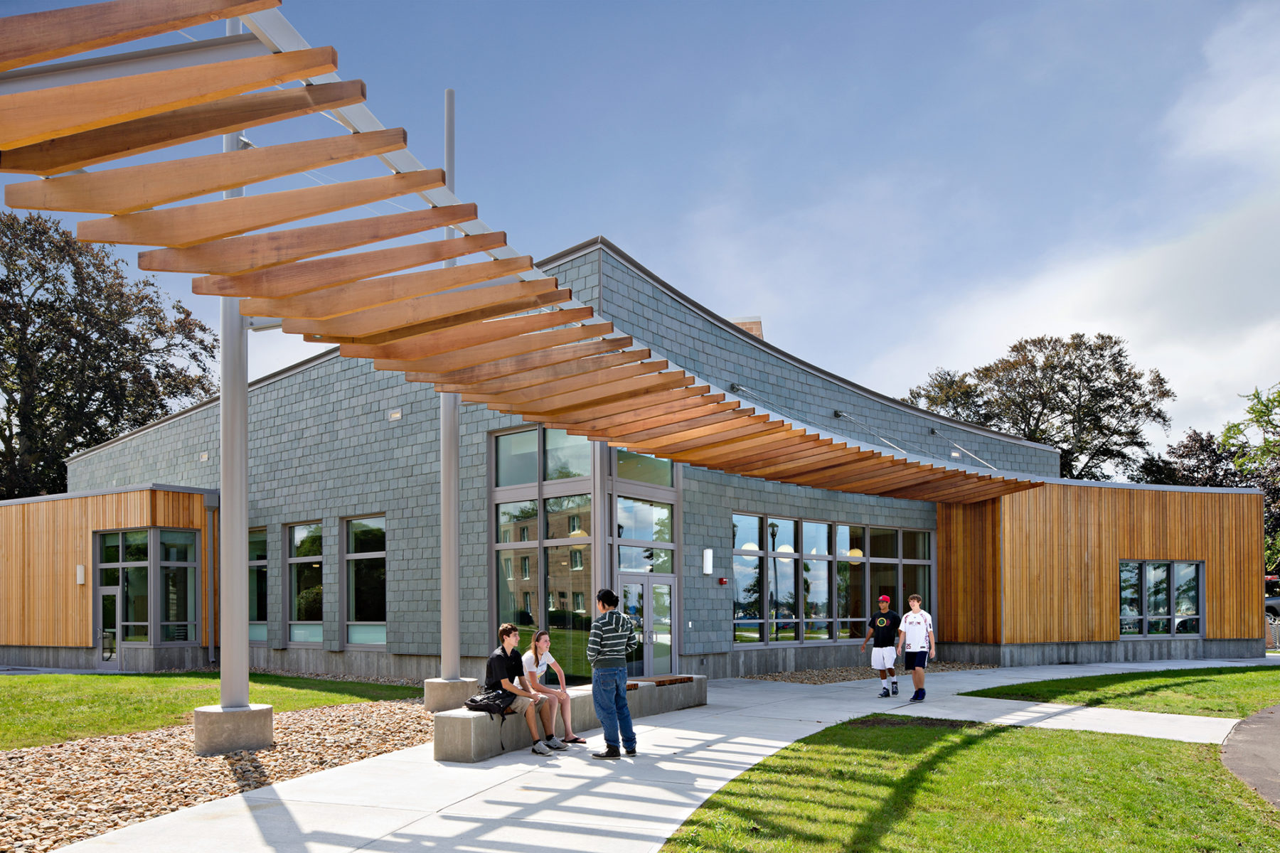 Exterior photo of building with large sun canopy