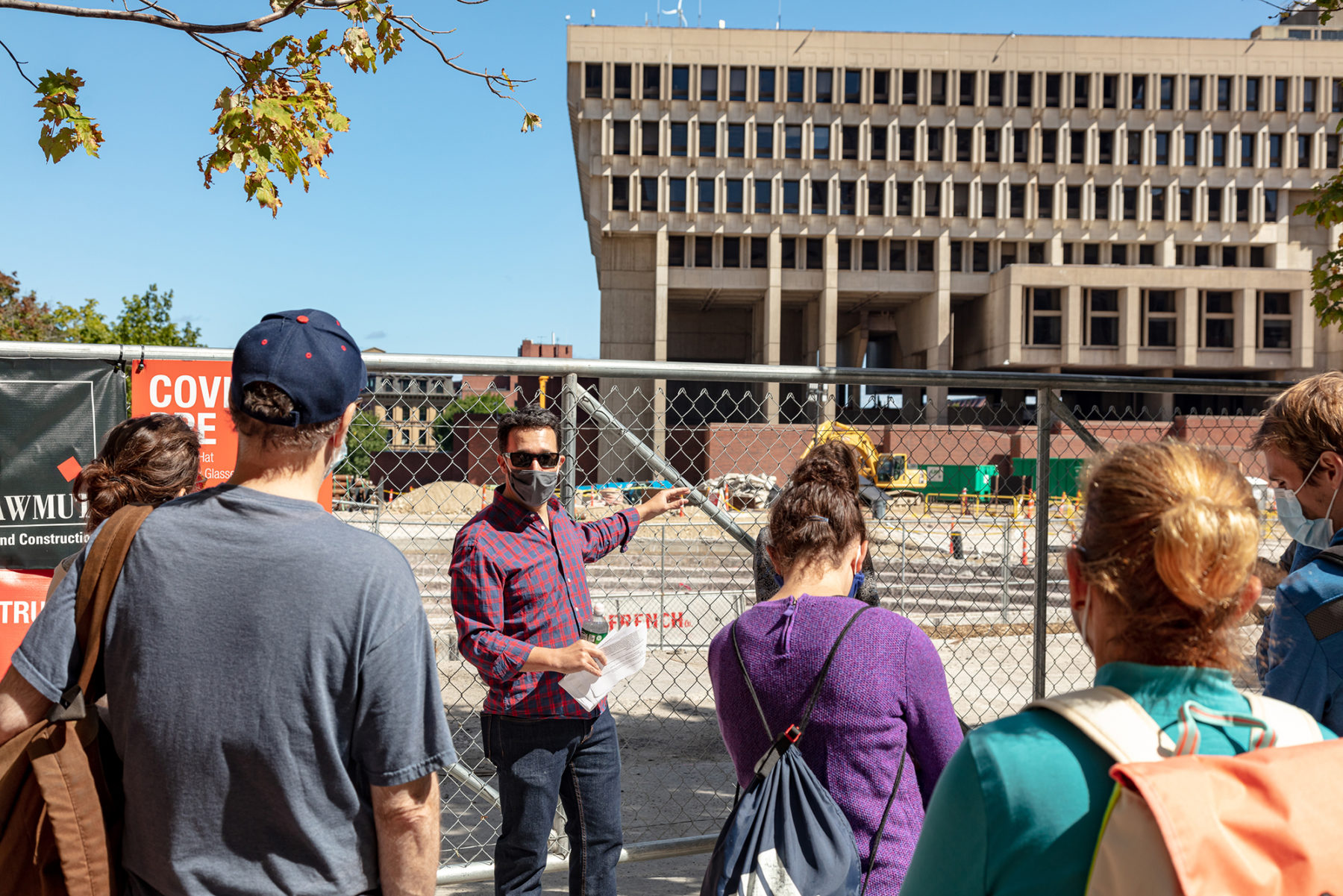 Mo Gomez leading tour group of City Hall Plaza