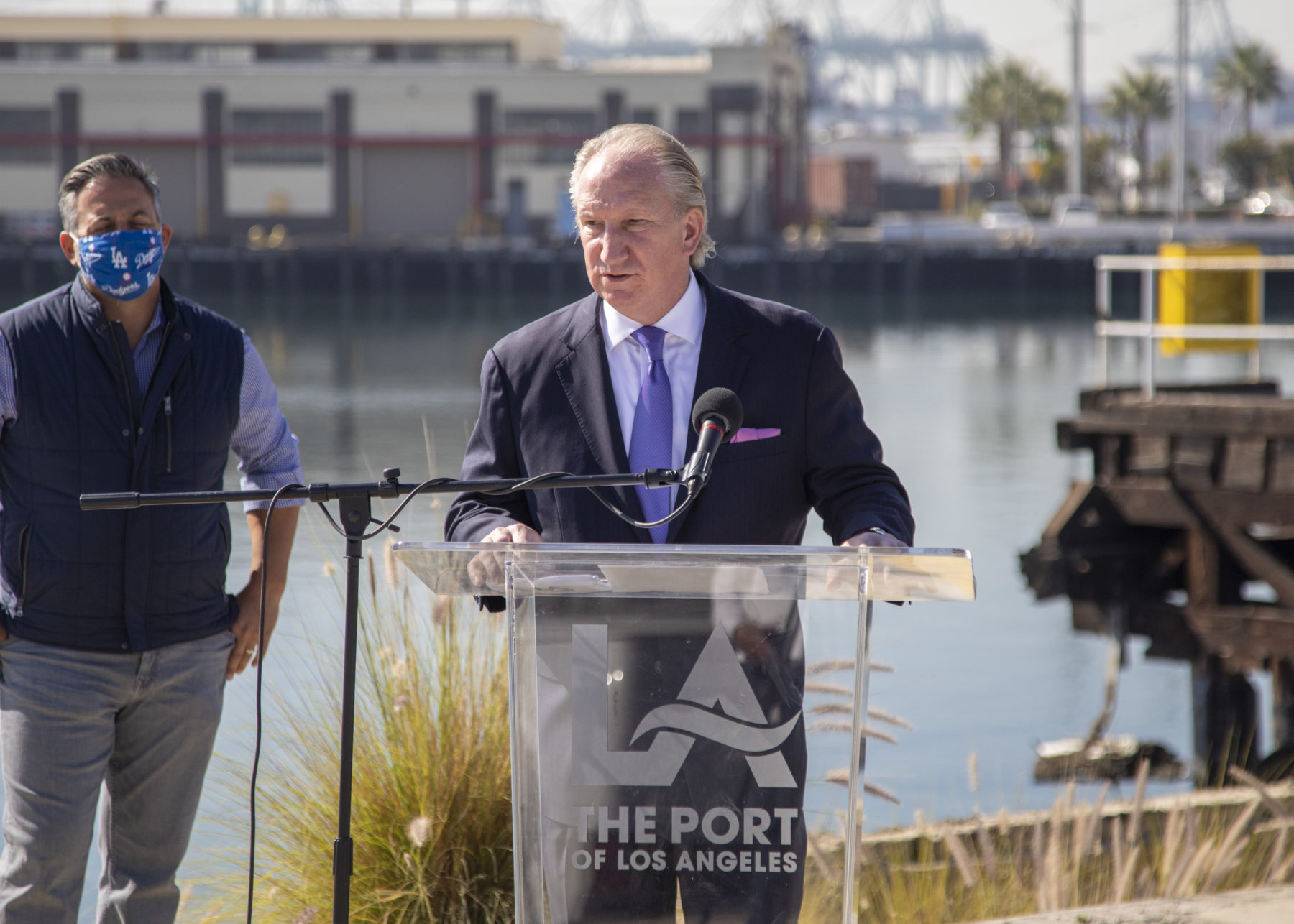 Man in suit speaking at podium