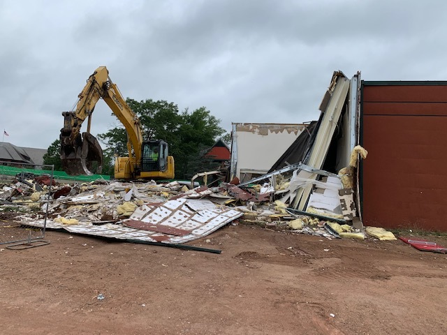a photo of a building being demolished at a construction site