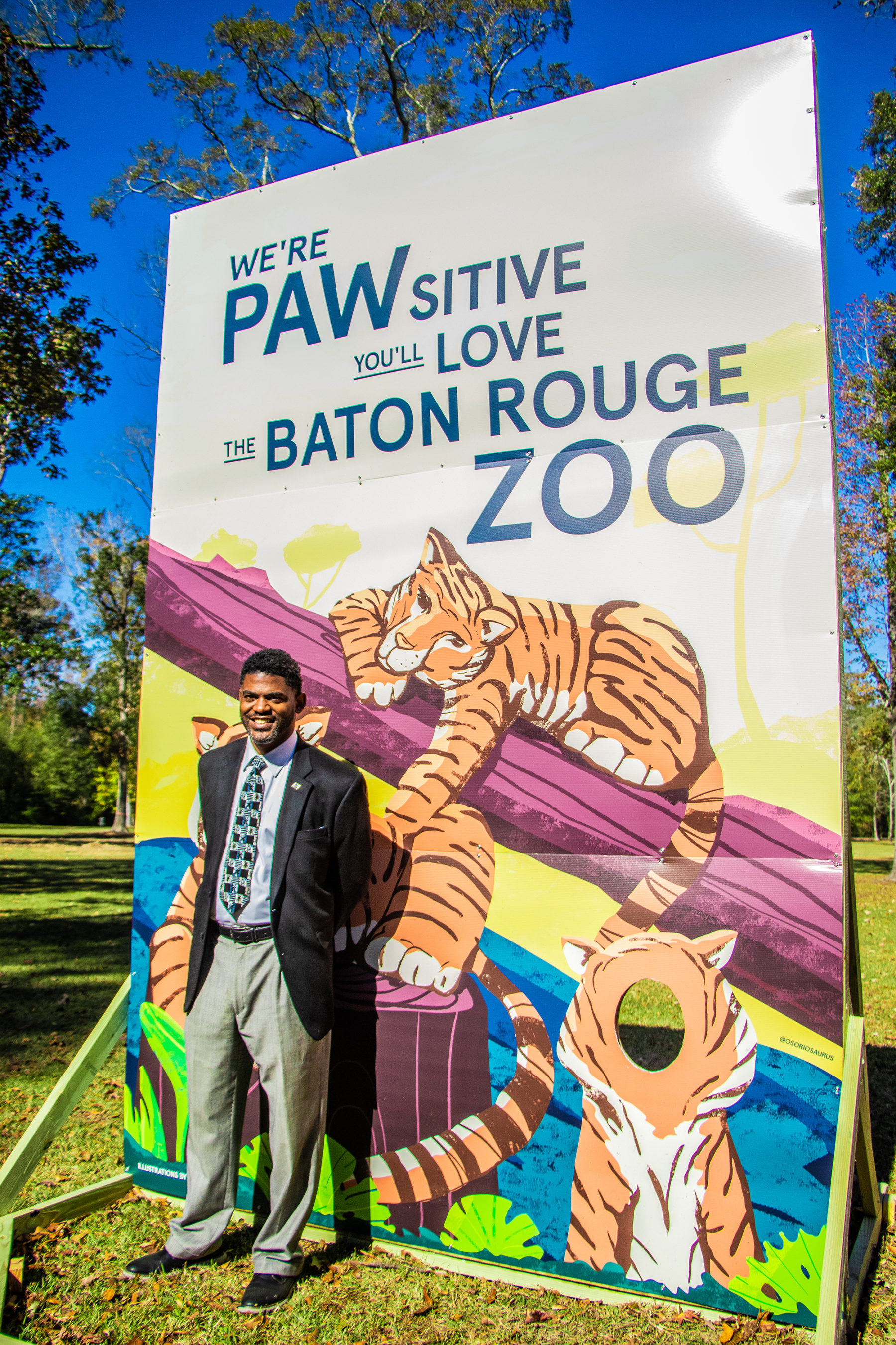 Corey Wilson standing in front of an illustrated board