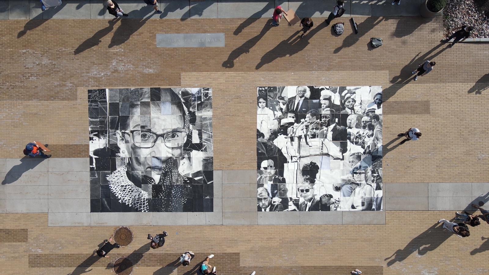 aerial photo of an art installation of Ruth Bader Ginsberg and John Lewis on a walking path