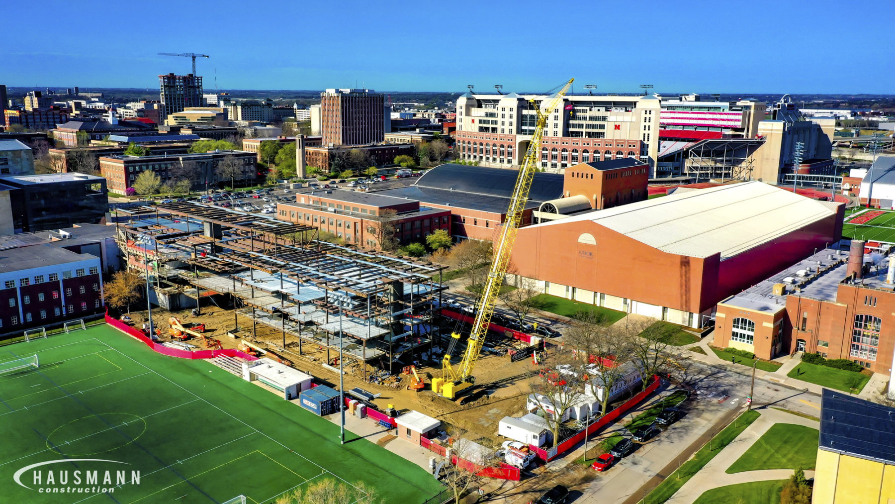 Drone photo of building under construction with large crane