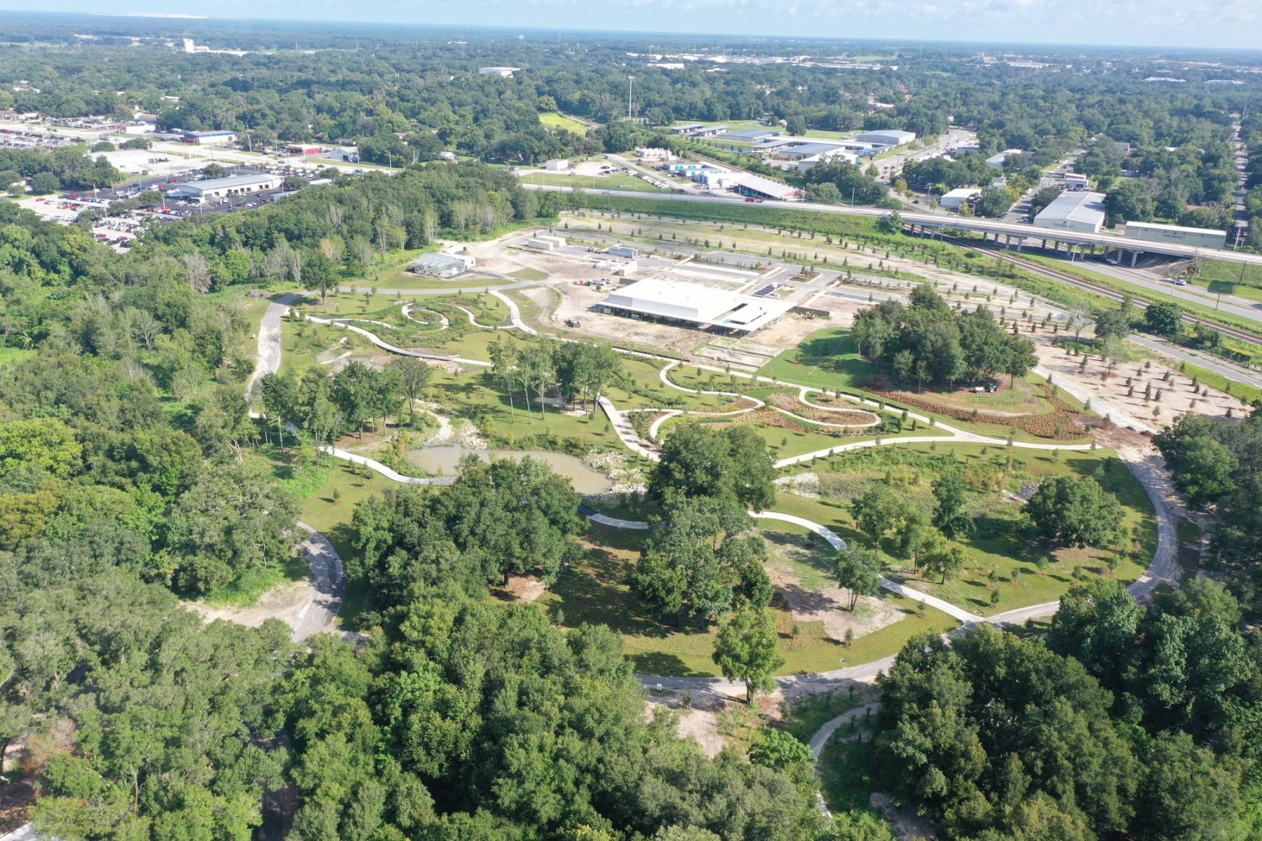 Aerial drone shot of Bonnet Springs Park showing building and site design in progress construction