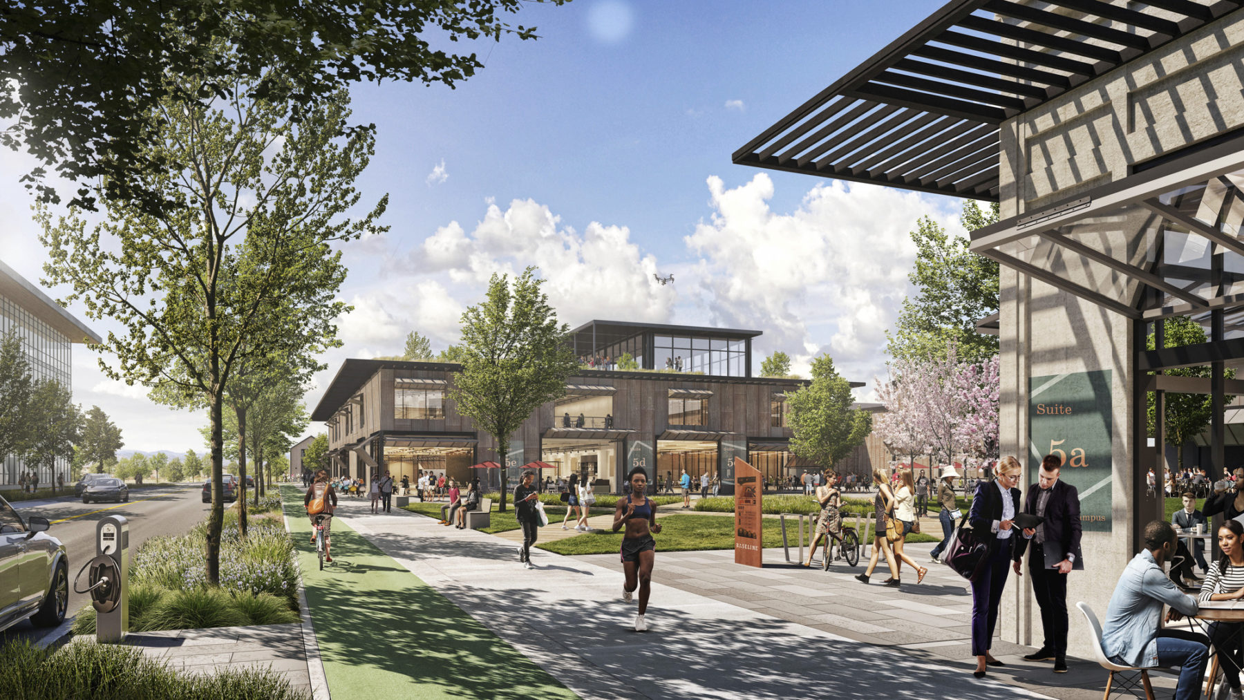 Rendering showing bike path, sidewalk, buildings, and outdoor seating, all actively in-use on a summer day