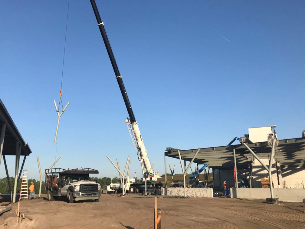 Construction image of crane and truck in dirt