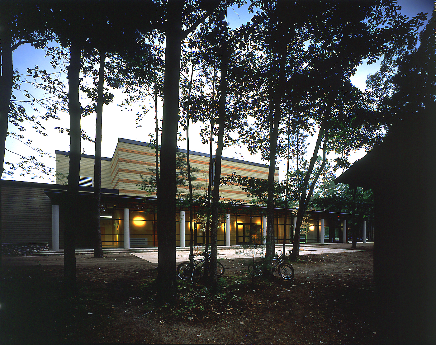 View of Harvey Theatre through the trees