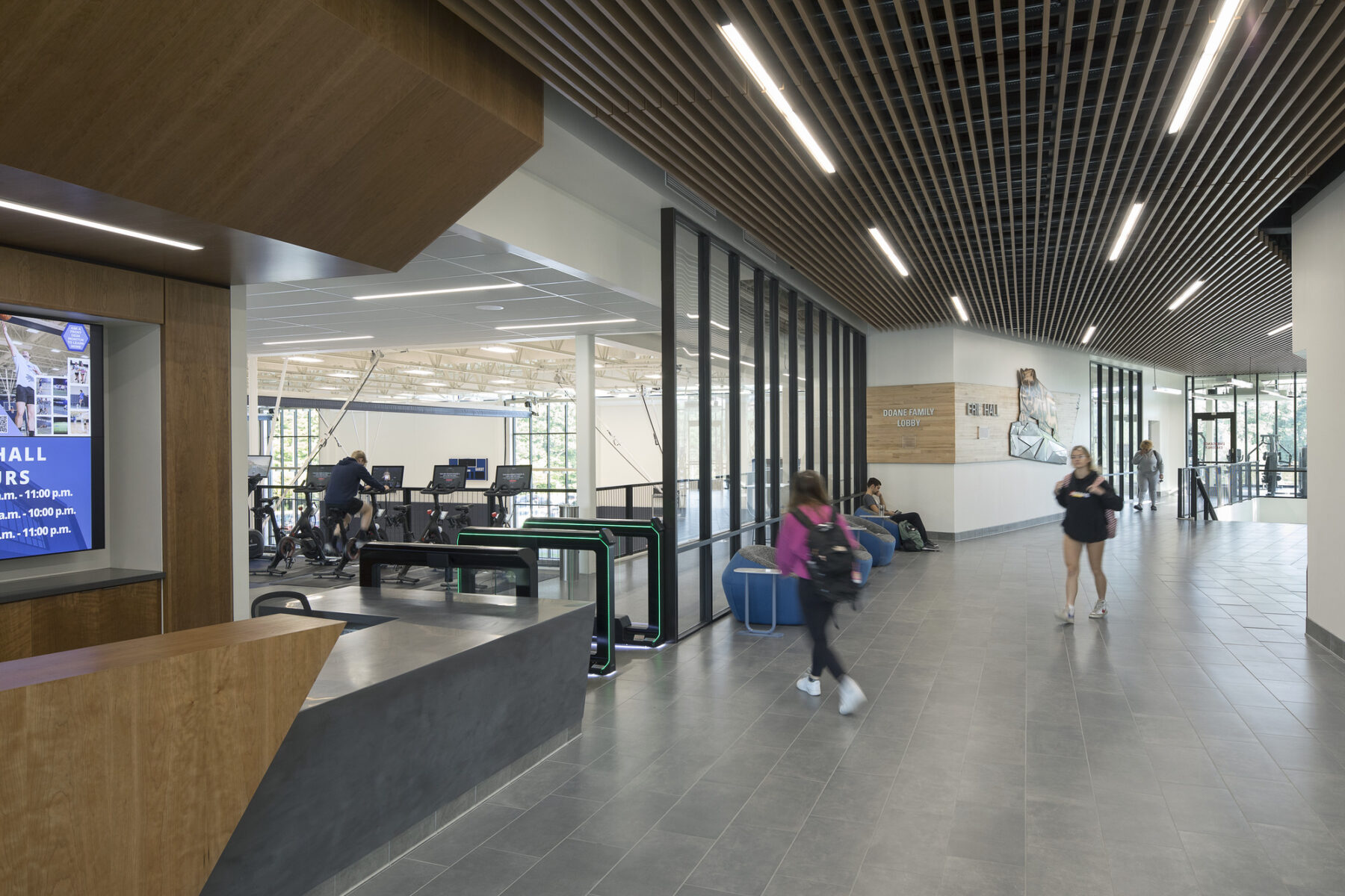 interior photo of recreation center lobby interior. Check-in desk on the left, corridor on the right