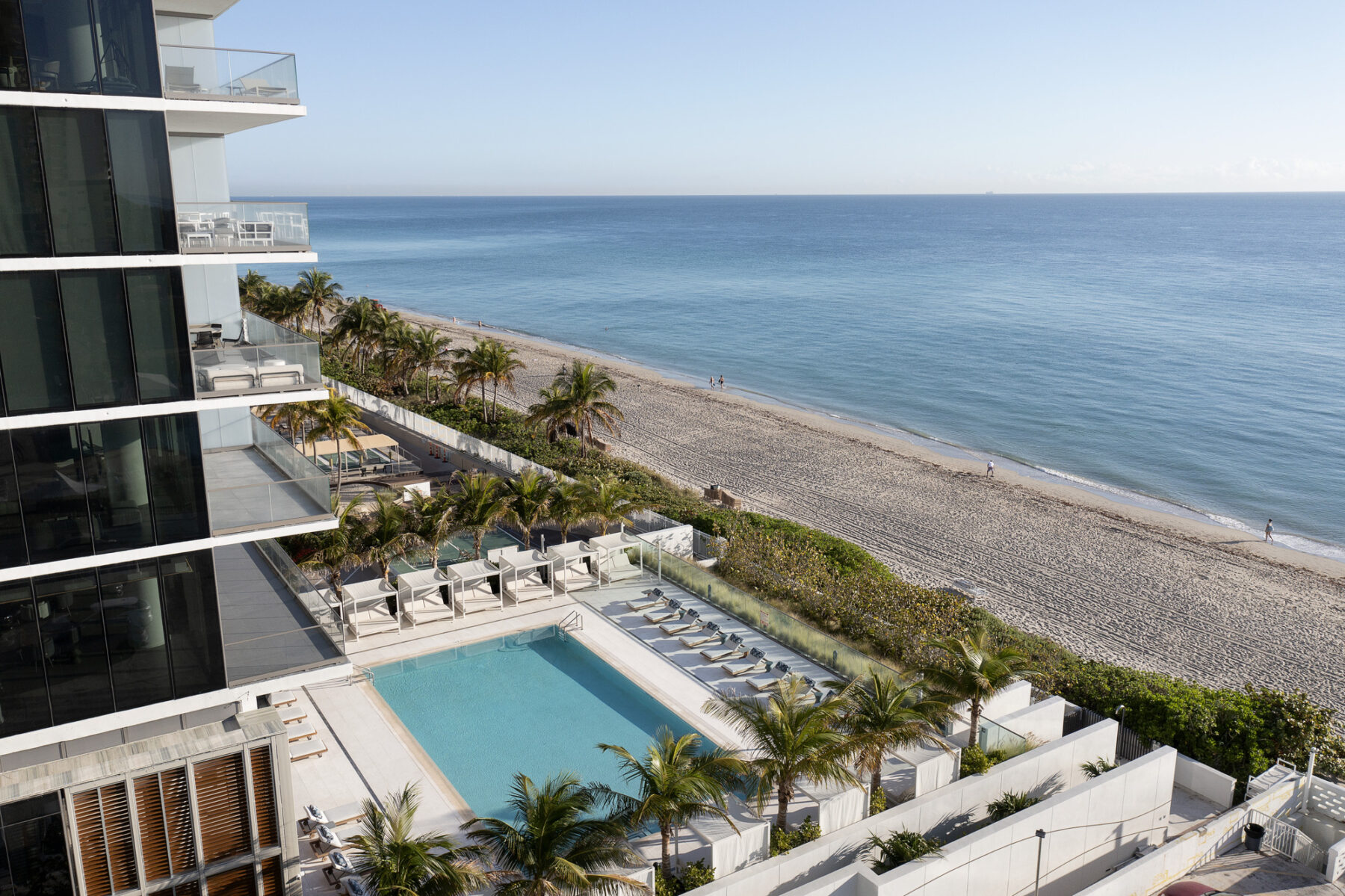 Perspective shot of 2000 Ocean Hallandale featuring pool area with tropical plantings