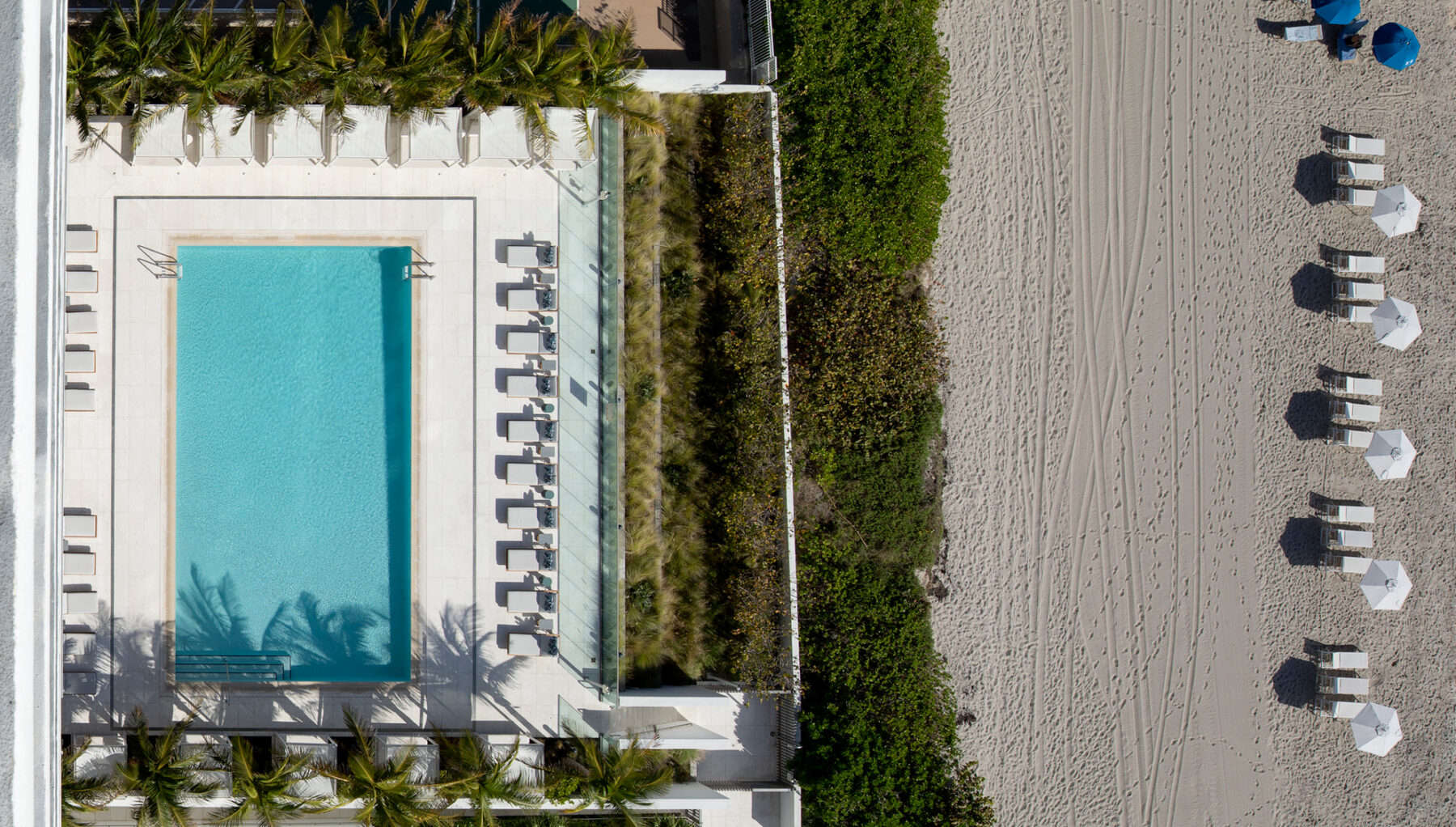 Aerial shot of 2000 Ocean Hallandale featuring pool meeting beach shoreline