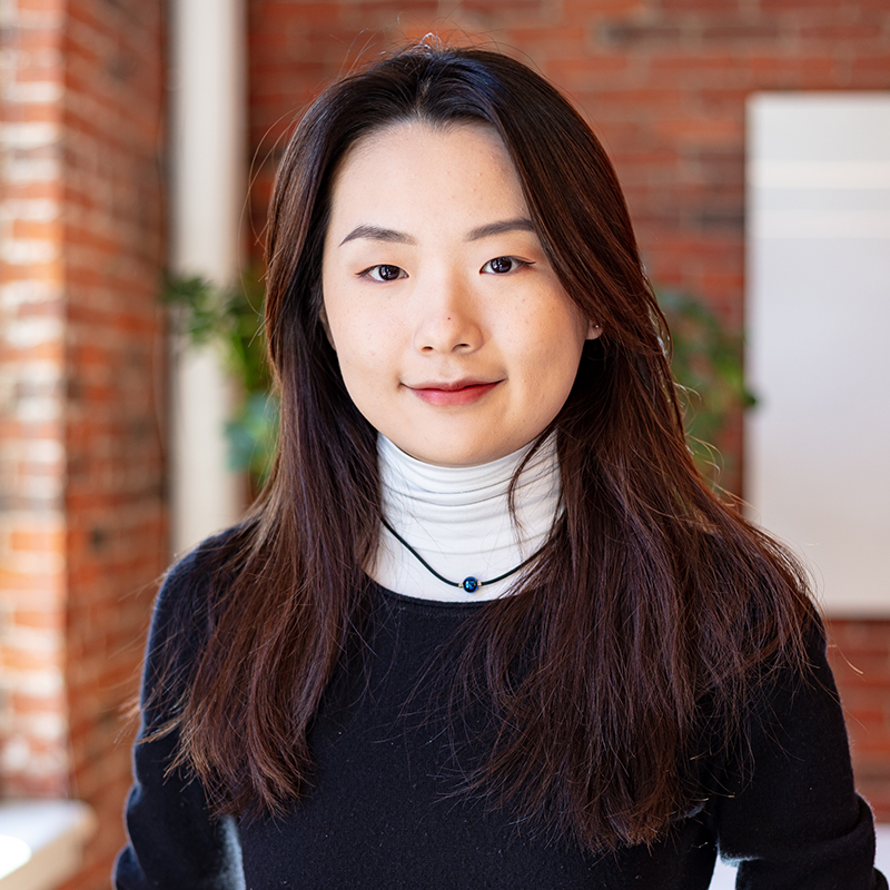 interior headshot in office space, female