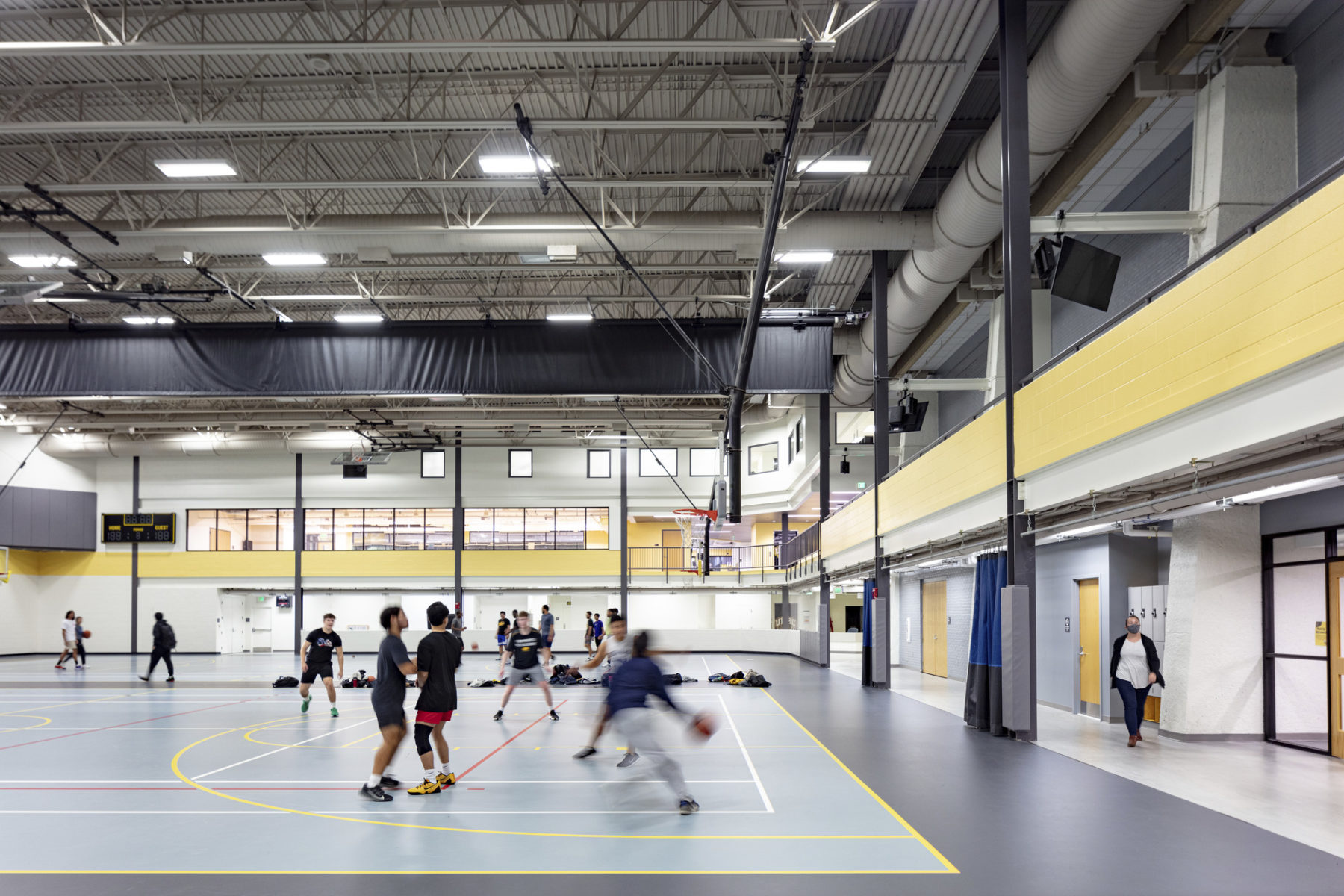 photo of students playing basketball on renovated gym
