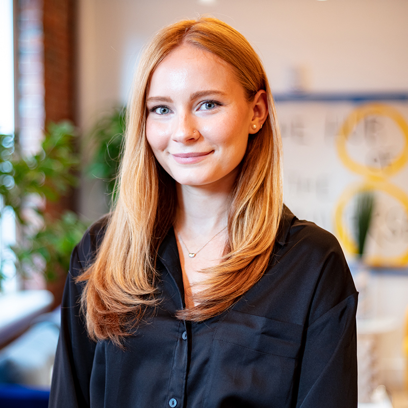 female interior headshot in office space