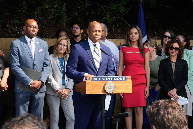 Photo of New York City Mayor Eric Adams speaking at a podium